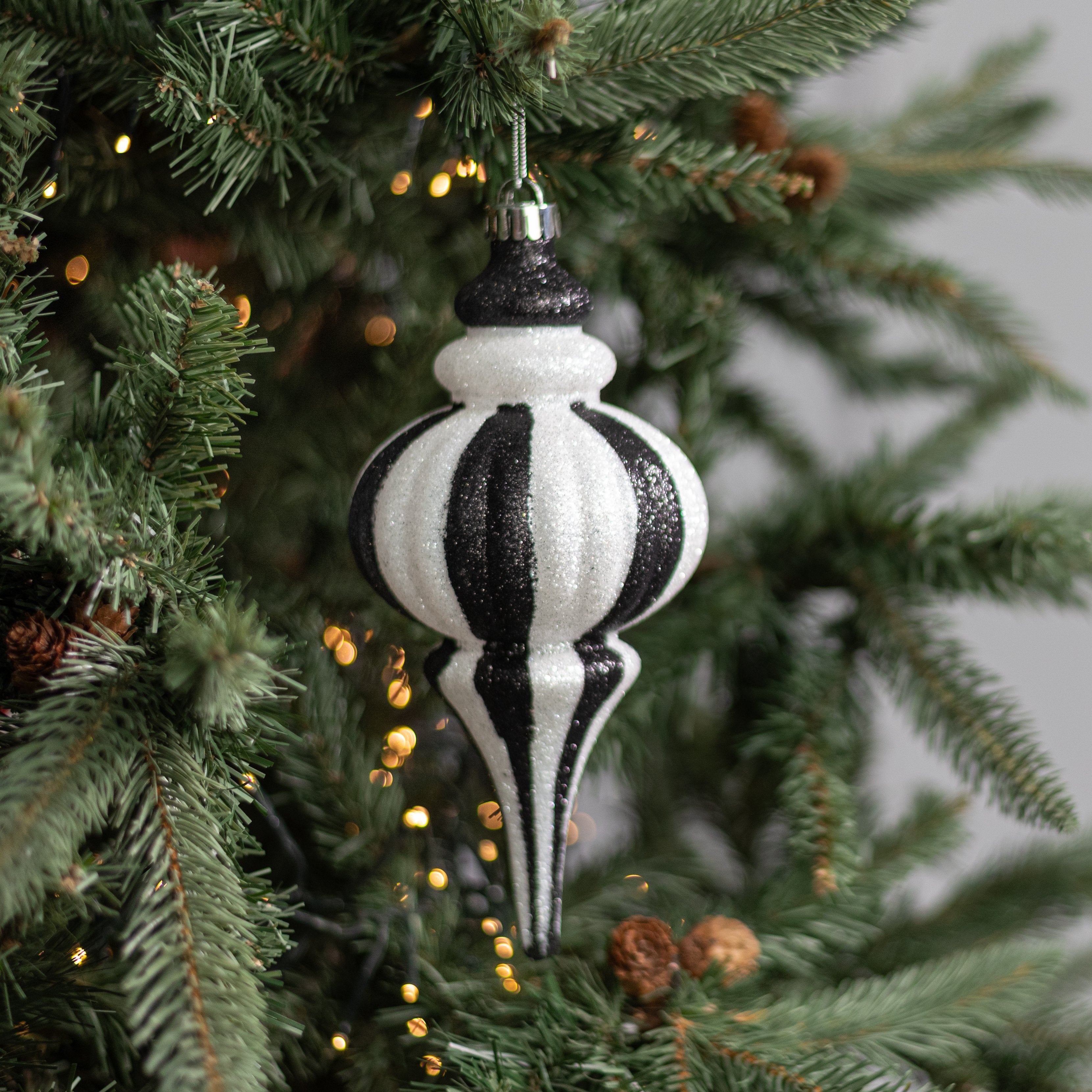 10" Glittered Finial Ornament: Black & White Lifestyle Photo