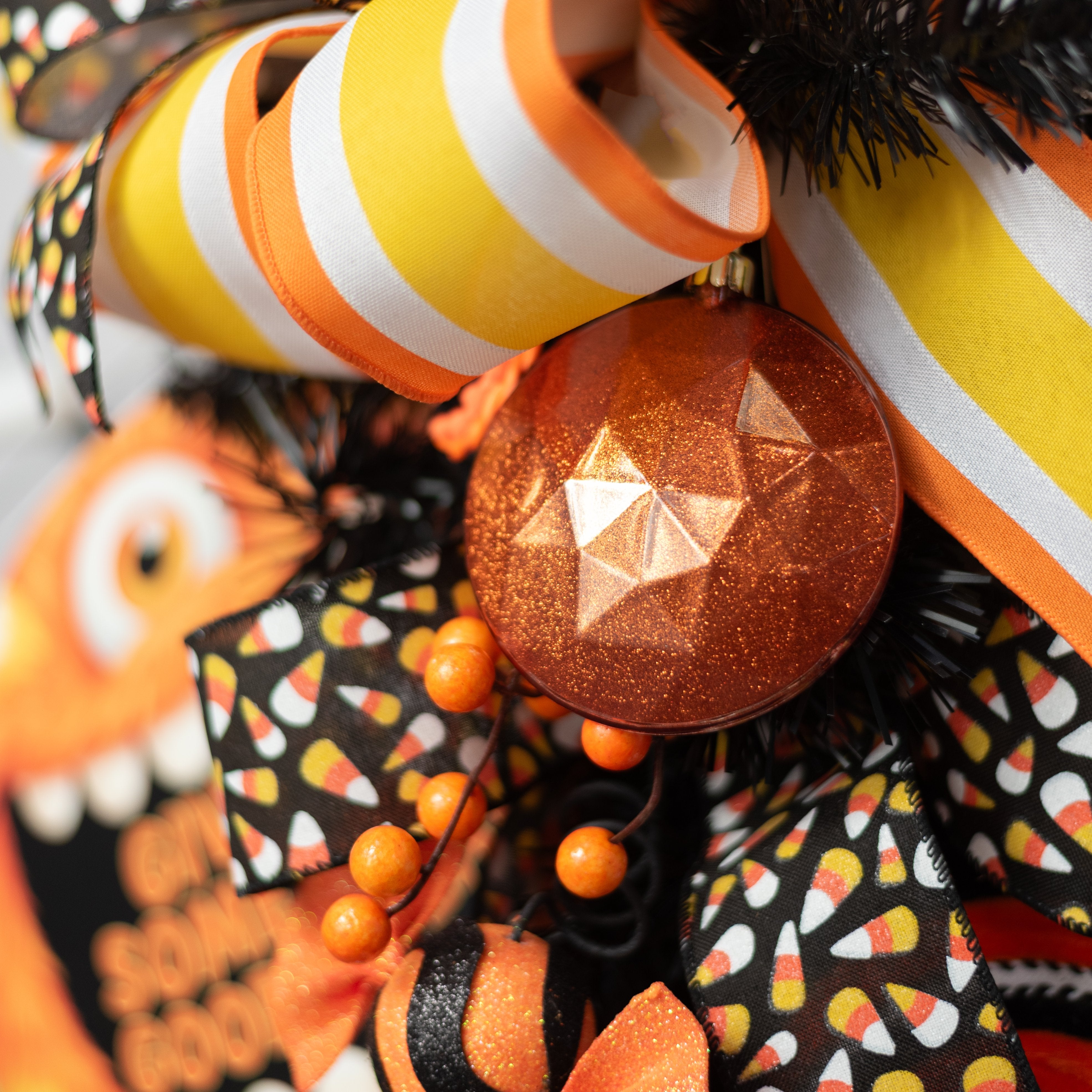 100mm Faceted Flat Round Gem Ornament: Glitter Inside Copper Orange Lifestyle Photo