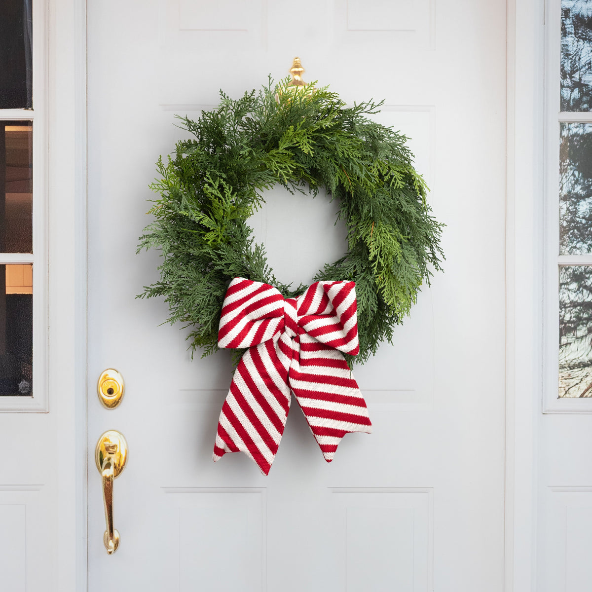 15" x 11.75" Red & White Peppermint Stripe Knit Bow Decoration Lifestyle Photo