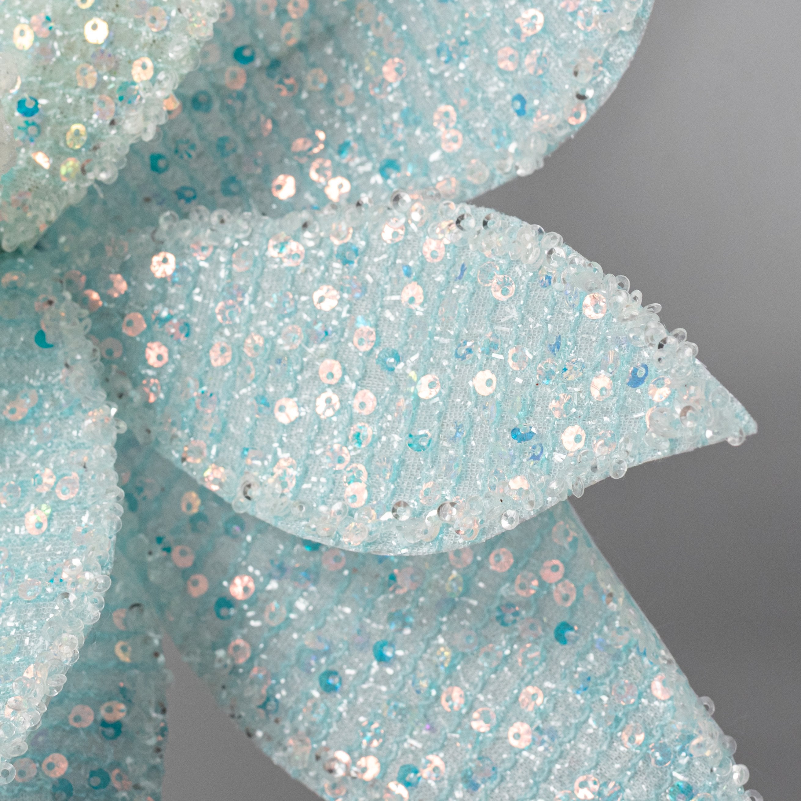 22" Iridescent Poinsettia Stem: Soft Blue Lifestyle Photo
