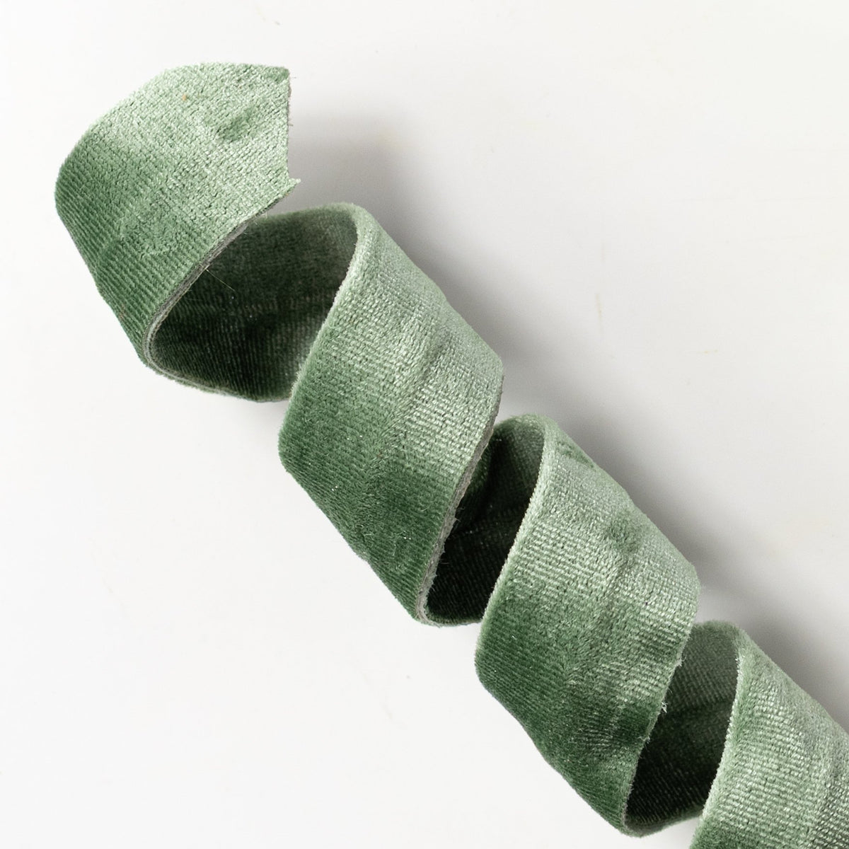 28" Velvet Curly Spray: Sage Green Lifestyle Photo