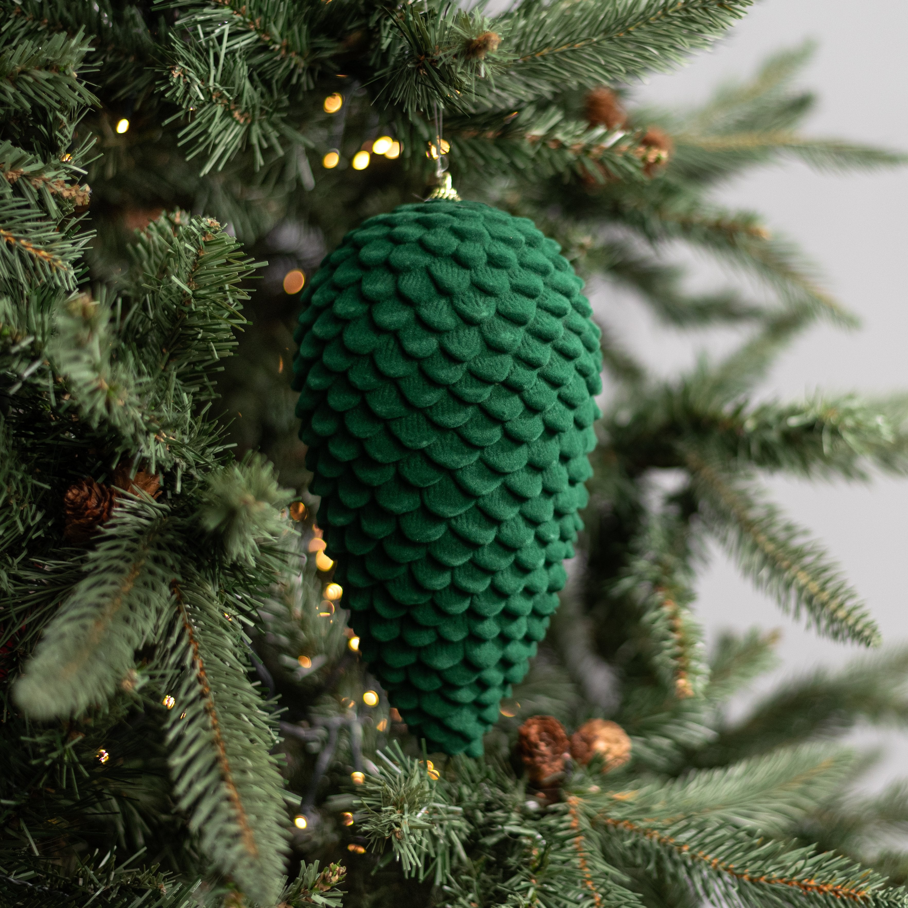 9.5" Flocked Pinecone Ornament: Dark Green Lifestyle Photo