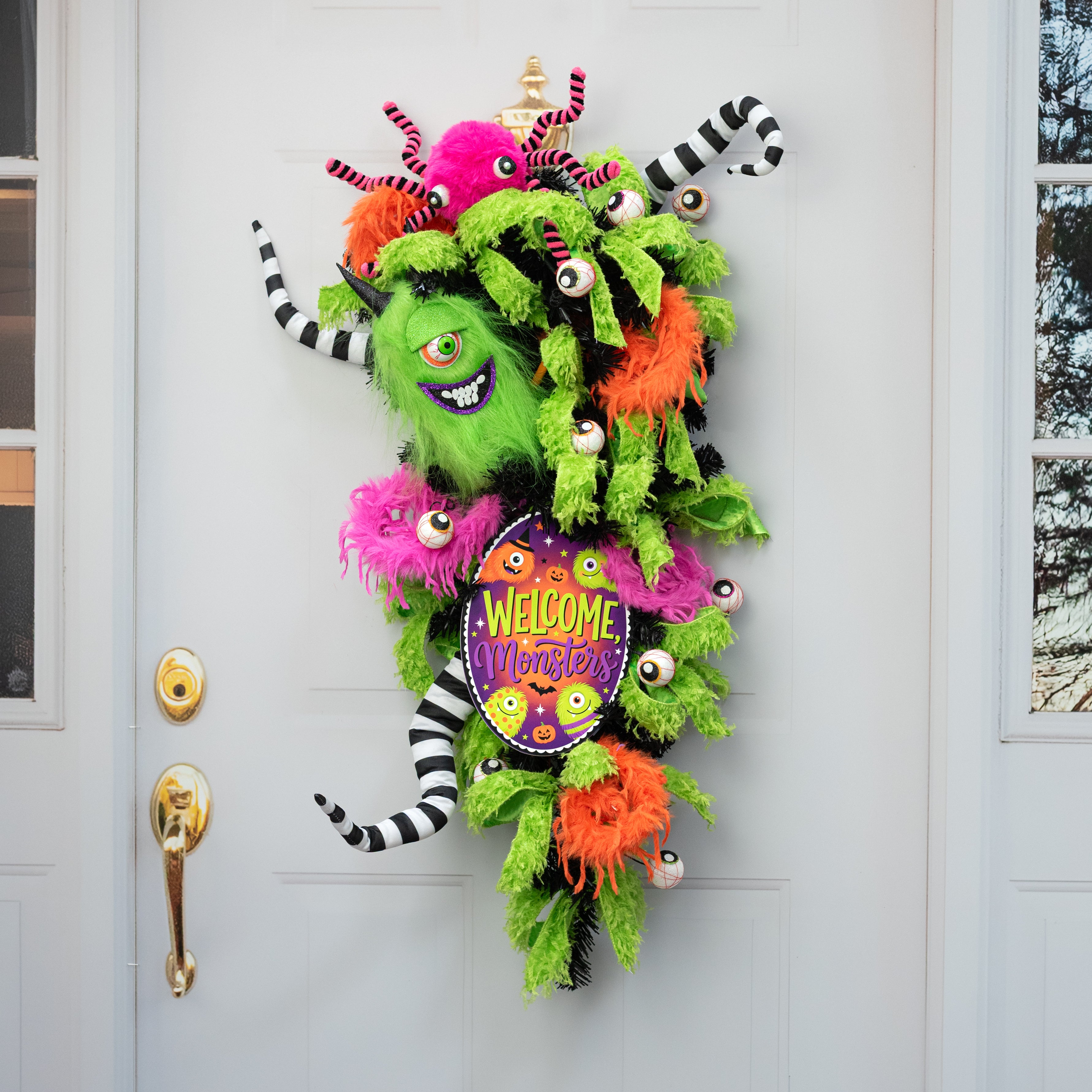 10.5" Oval Waterproof Sign: Furry One-Eyed Halloween Monsters