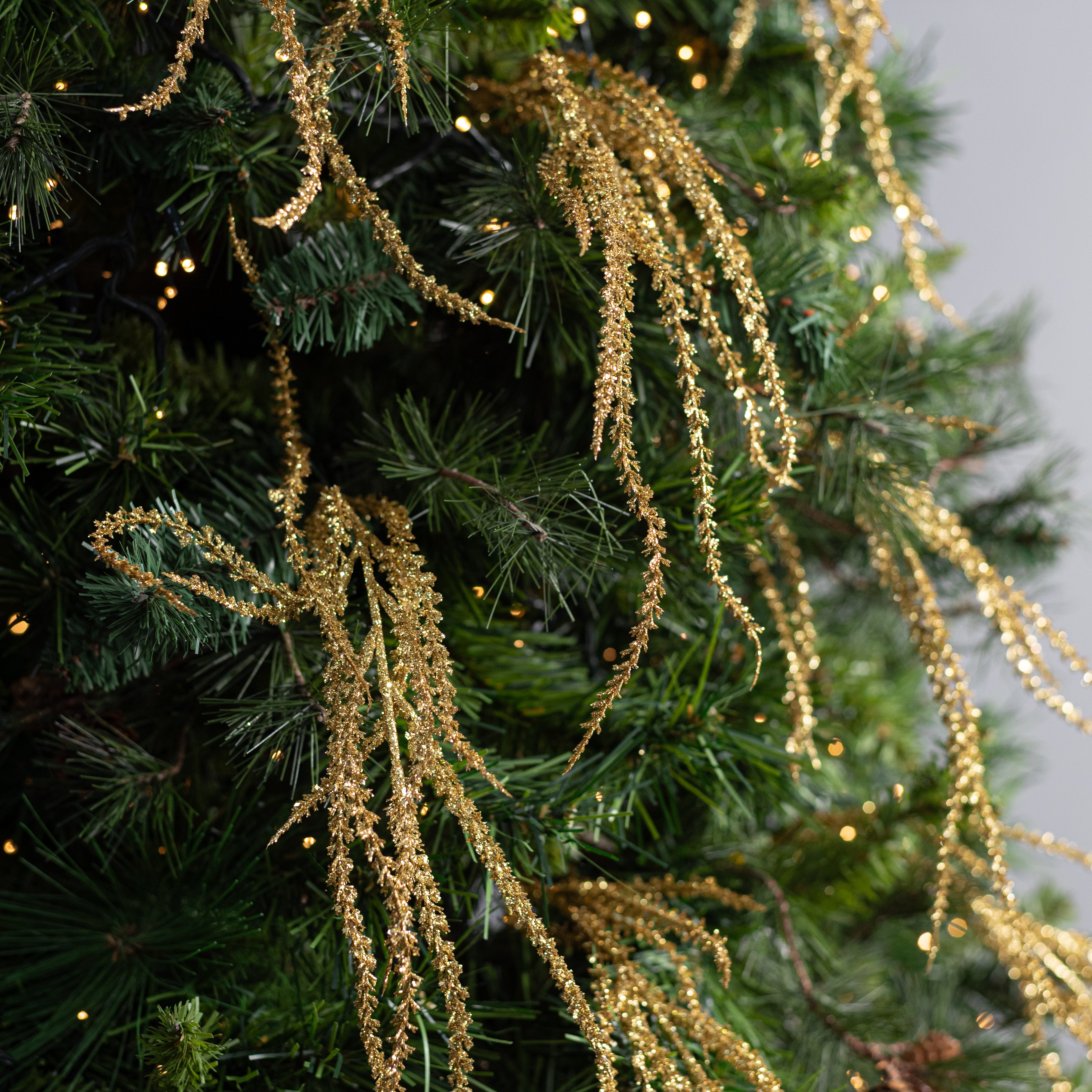 22" Glittered Willow Branches Spray: Gold