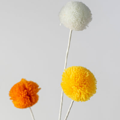 23" 3-Color Pom Pom Spray: Candy Corn Hues Lifestyle Photo