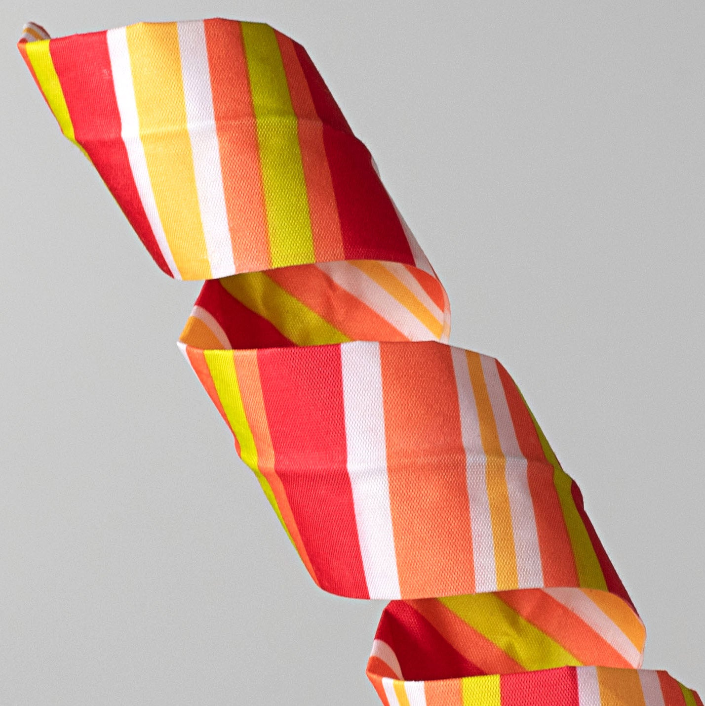30" Fabric Stripe Curly Spray: Orange, Yellow, Lime Green, Red Lifestyle Photo