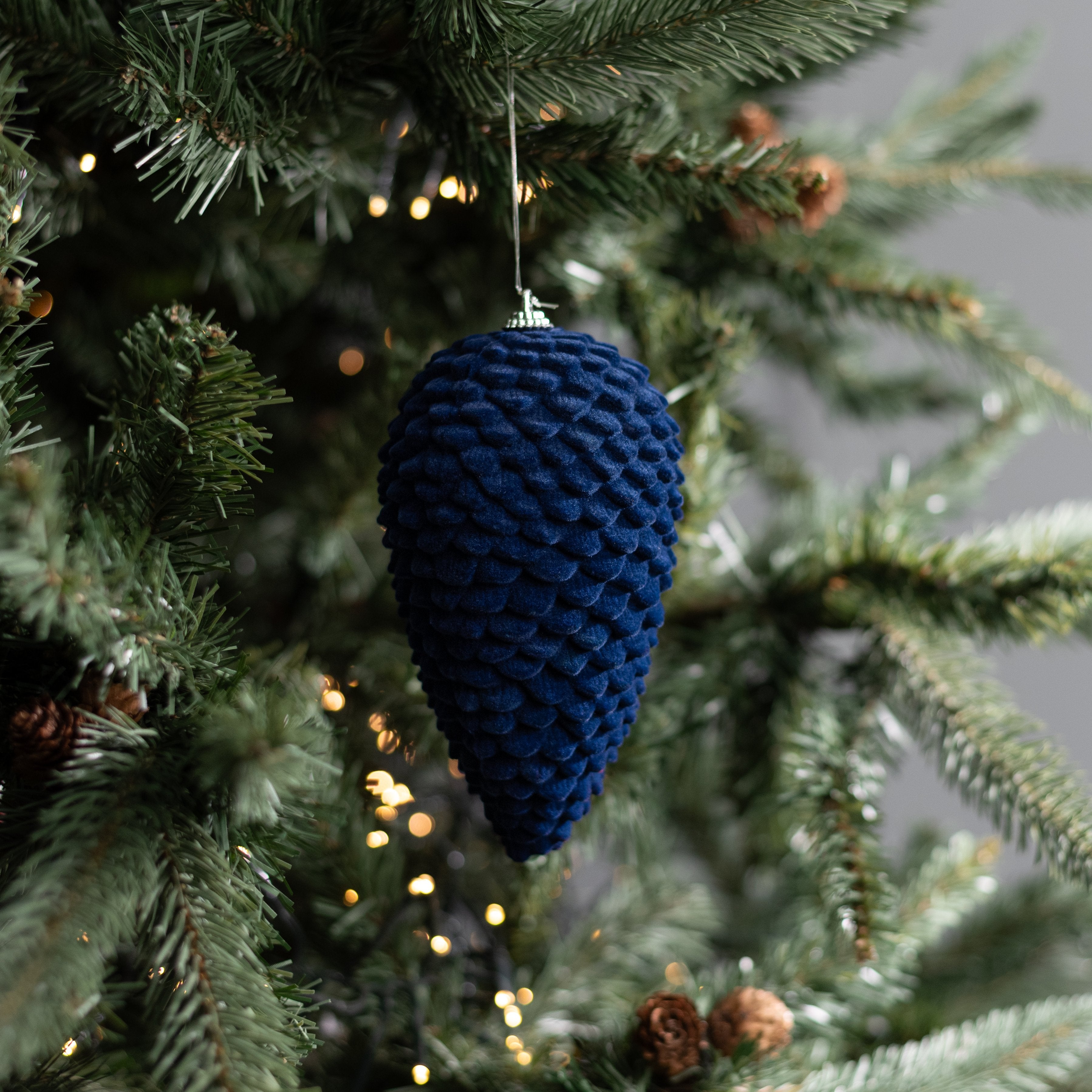 6" Flocked Pinecone Ornament: Dark Blue Lifestyle Photo