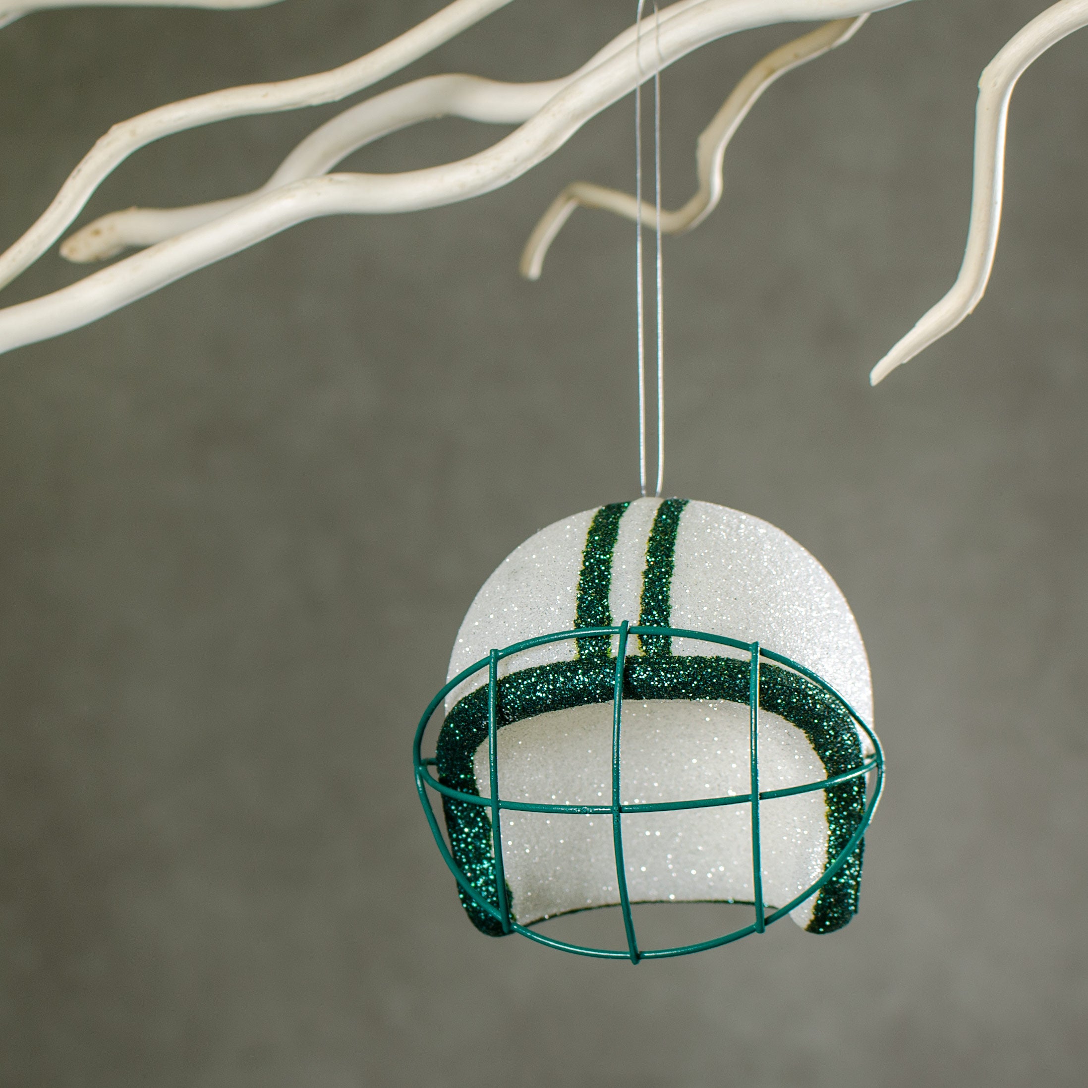 Football Helmet Ornament: White & Emerald Green (4") Lifestyle Photo