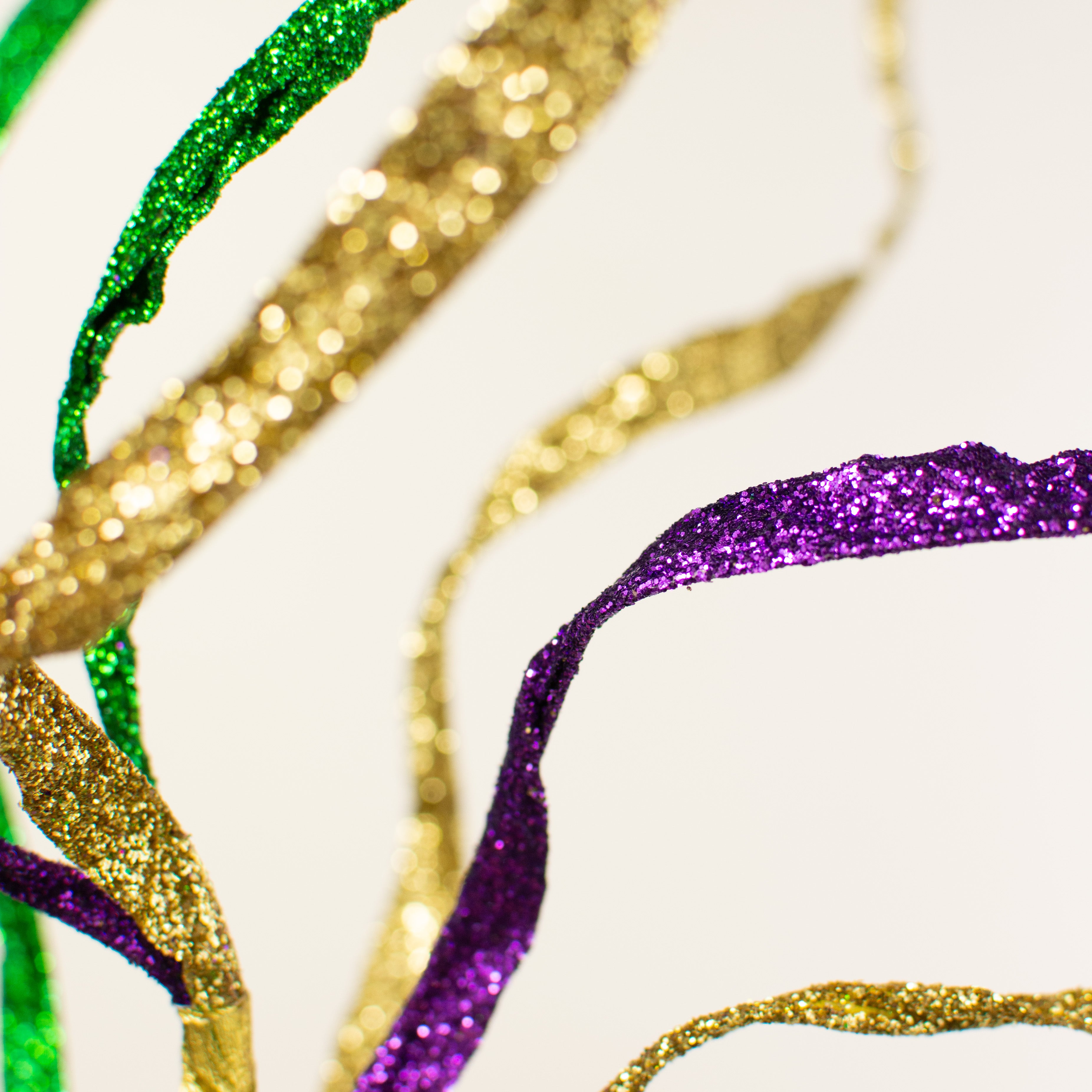 36" Glitter Curly Paper Grass Spray: Purple, Green, Gold Lifestyle Photo