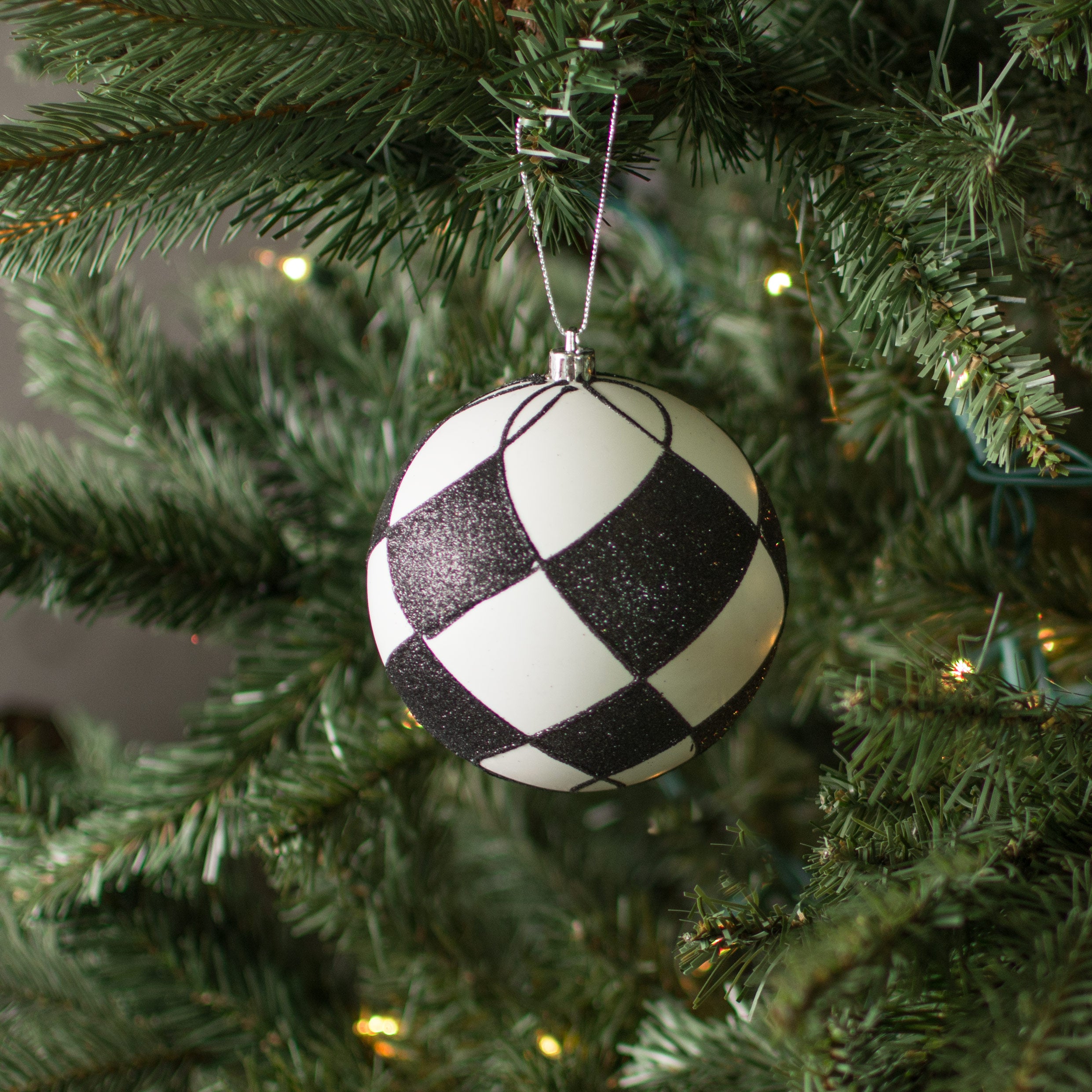 4" Glitter Harlequin Ball Ornament: Black & White Lifestyle Photo
