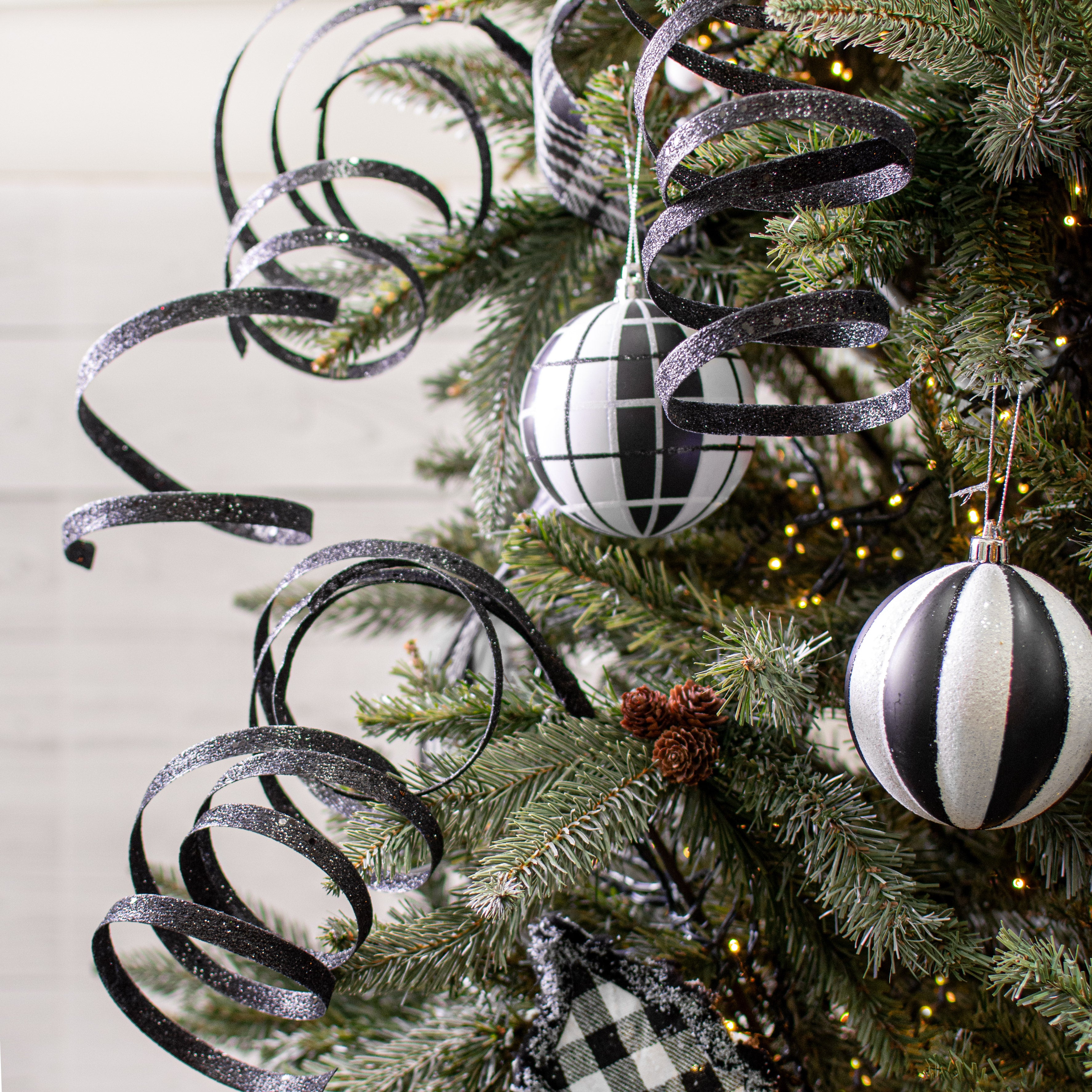 25" Glitter Spiral Ribbon Spray: Black Lifestyle Photo