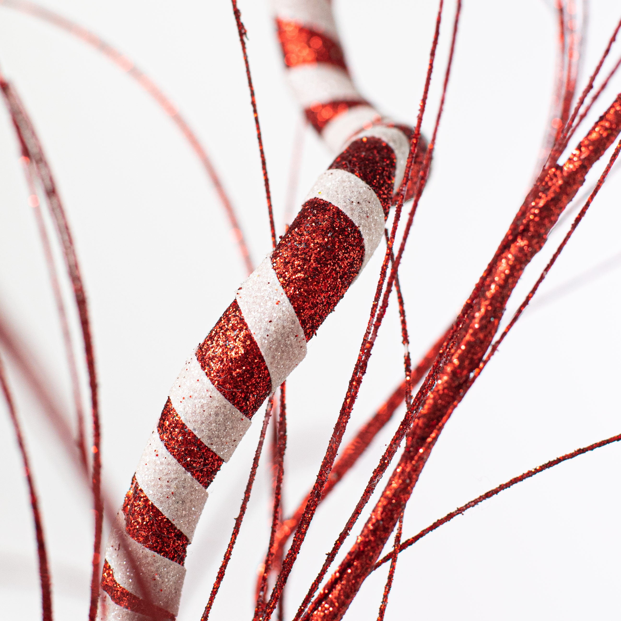 34" Glitter Twist Grass Spray: Red & White Lifestyle Photo