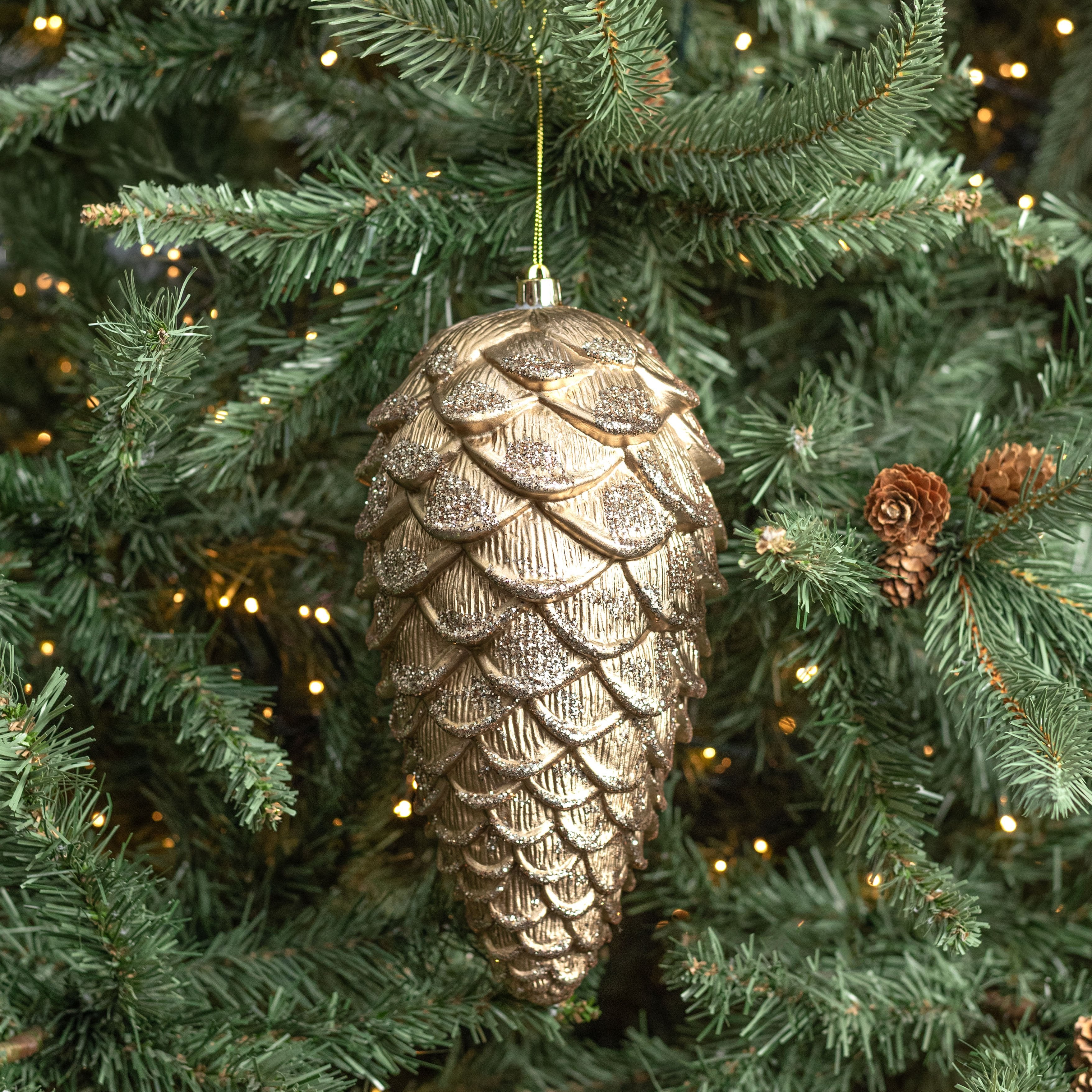 9" Glittered Metallic Pinecone Ornament: Champagne Gold Lifestyle Photo