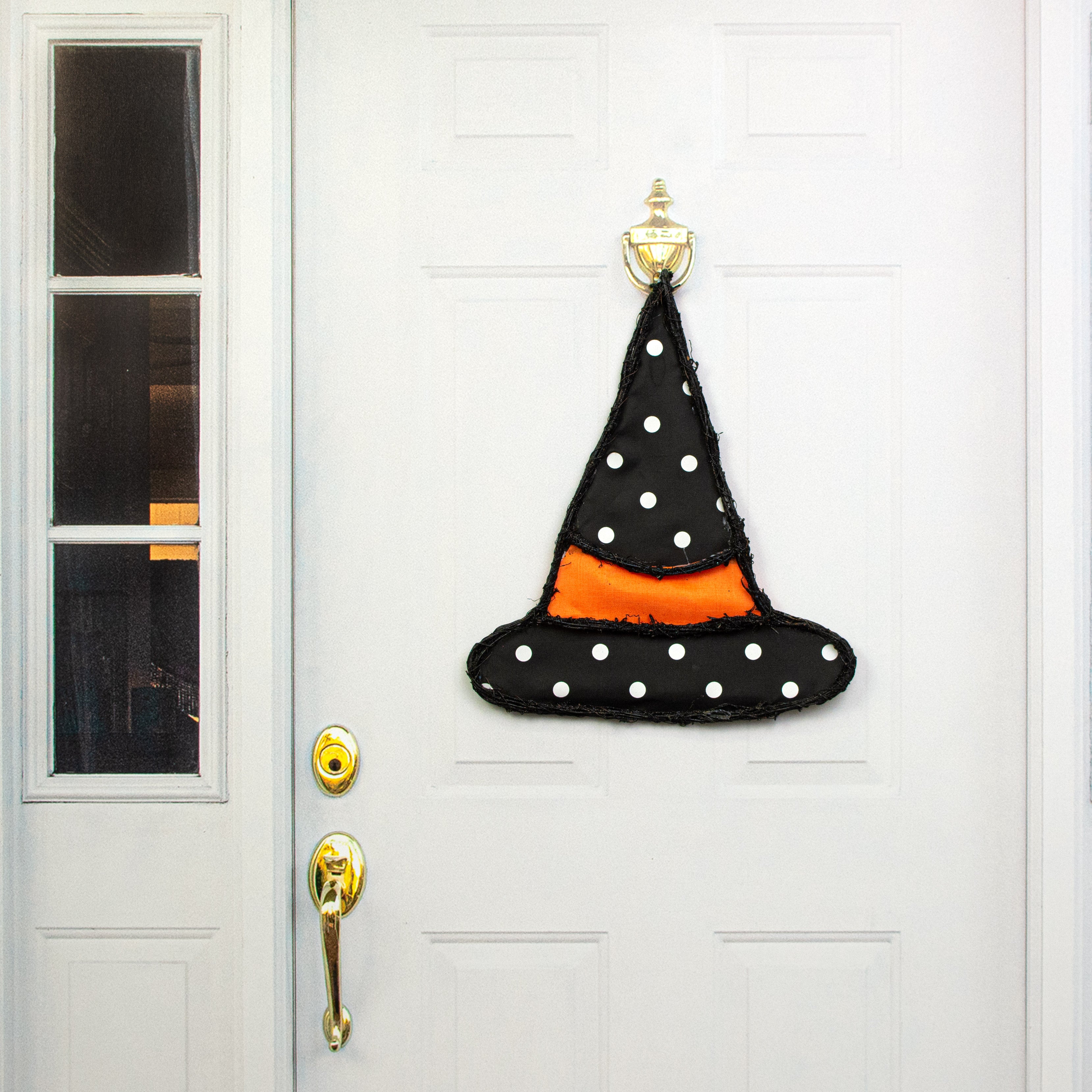 21" Grapevine Hanger: Black Polka Dot Witch Hat Lifestyle Photo