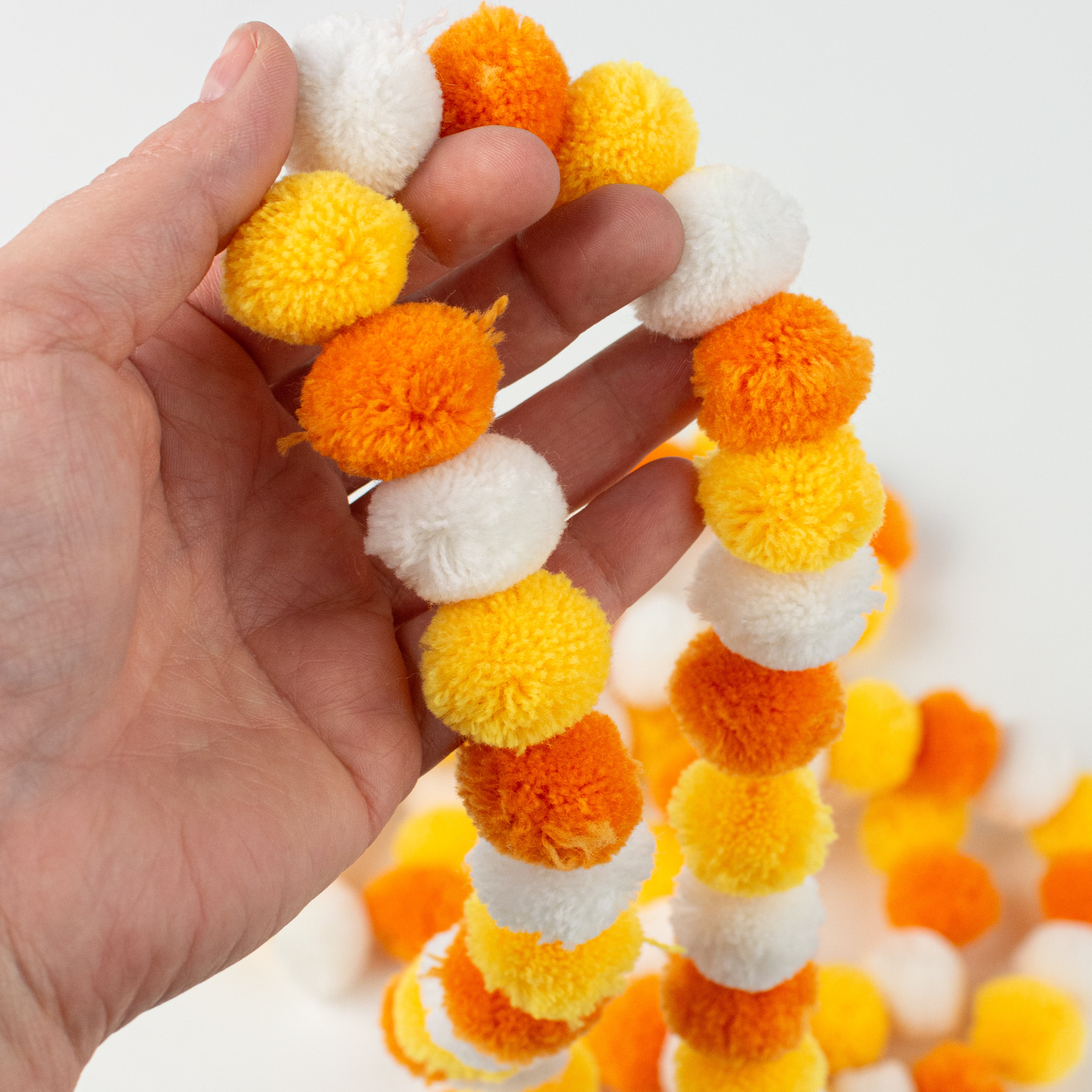68" Pom Pom Garland: Candy Corn Hues