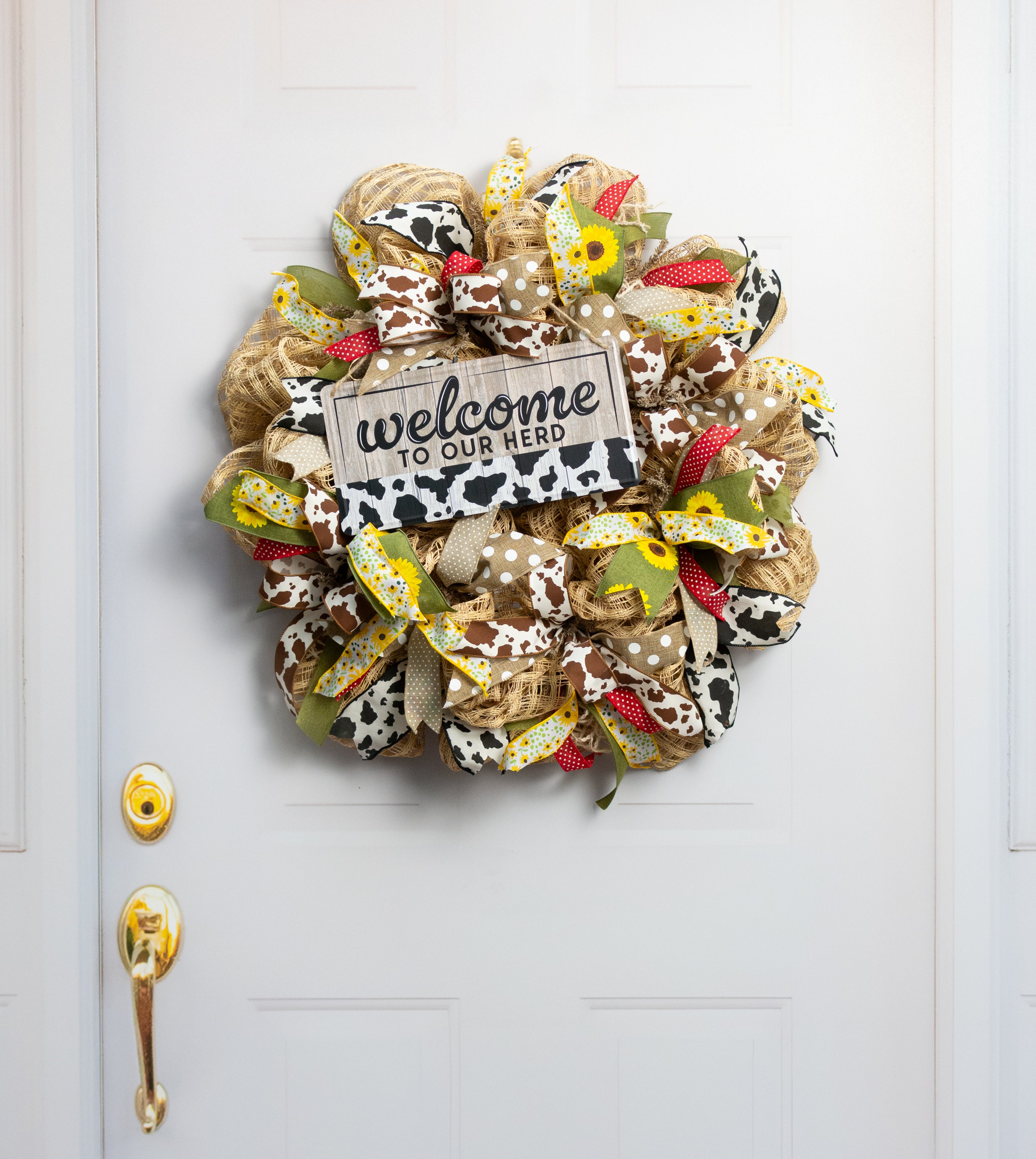 12" Embossed Tin Sign: Welcome to our Herd Black Cow Print