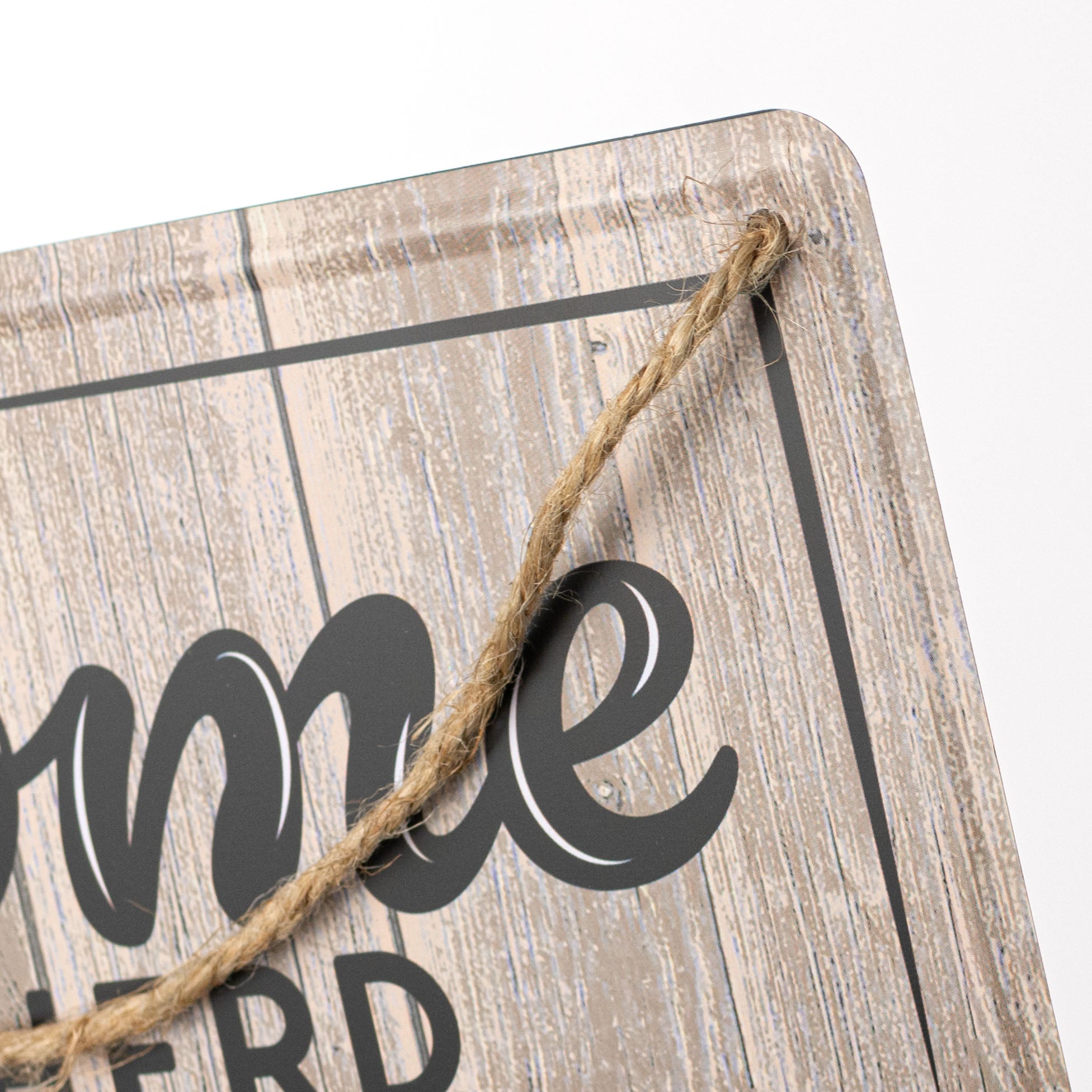 12" Embossed Tin Sign: Welcome to our Herd Black Cow Print