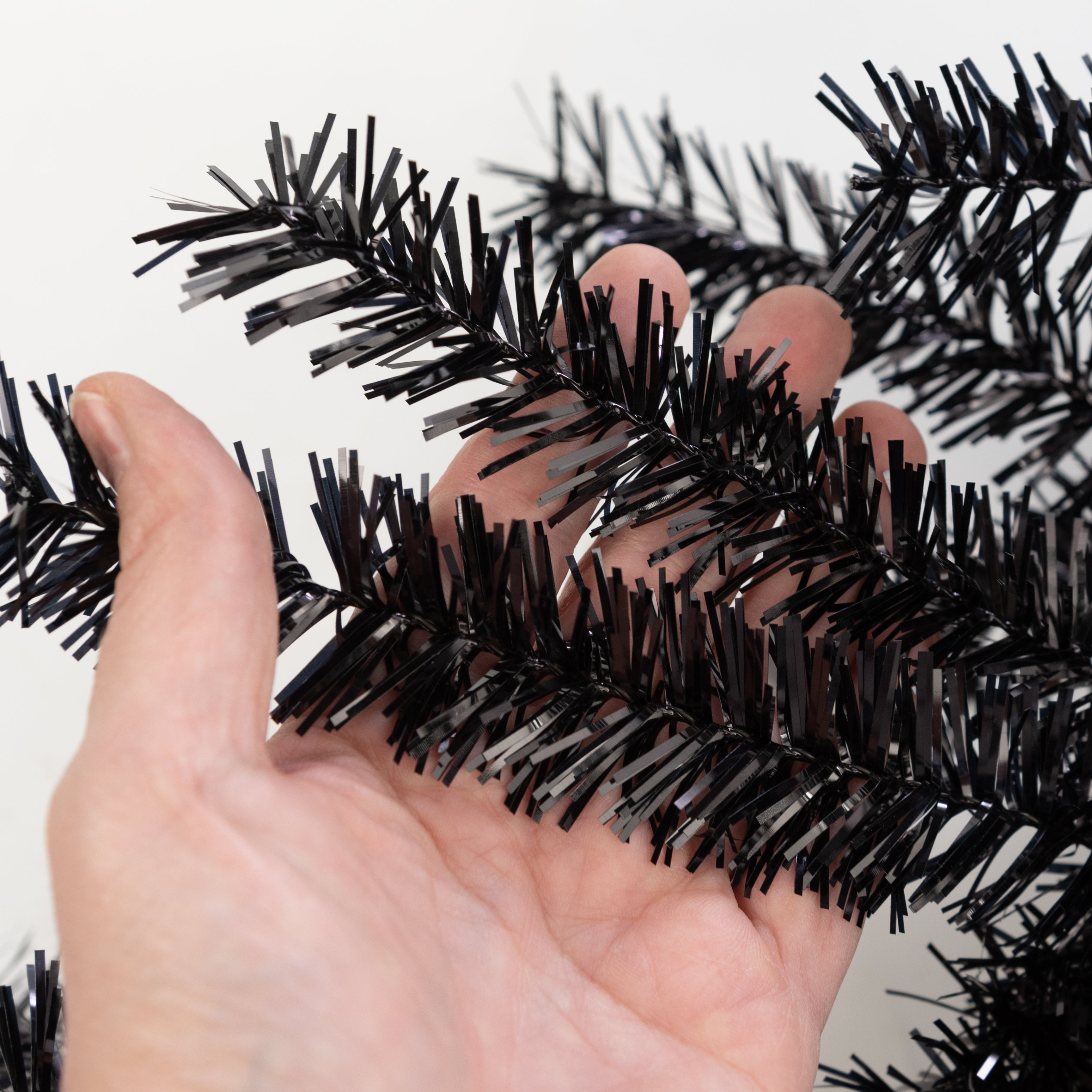 9' PVC Pine Tinsel Garland: Metallic Black
