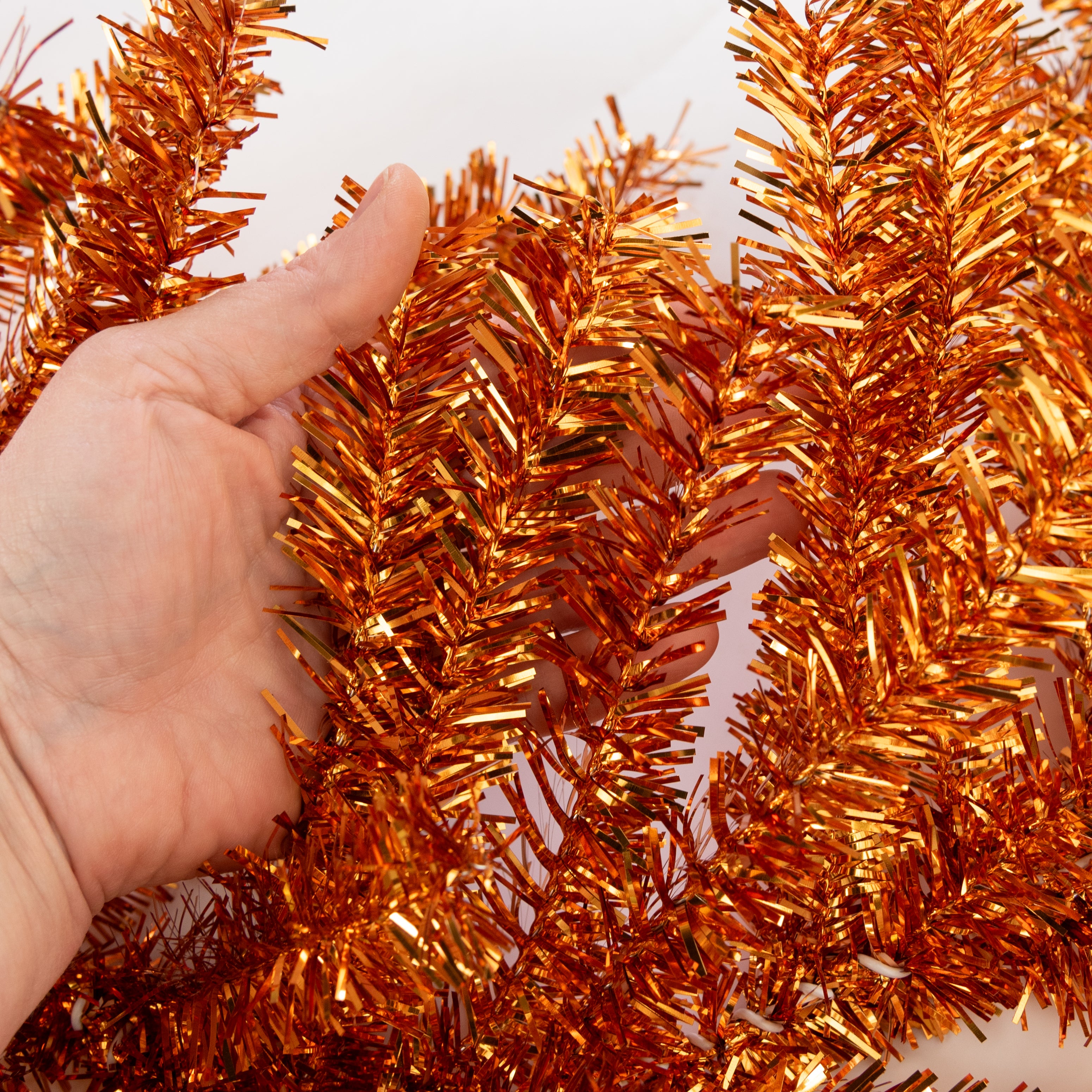 9' PVC Pine Tinsel Garland: Metallic Orange