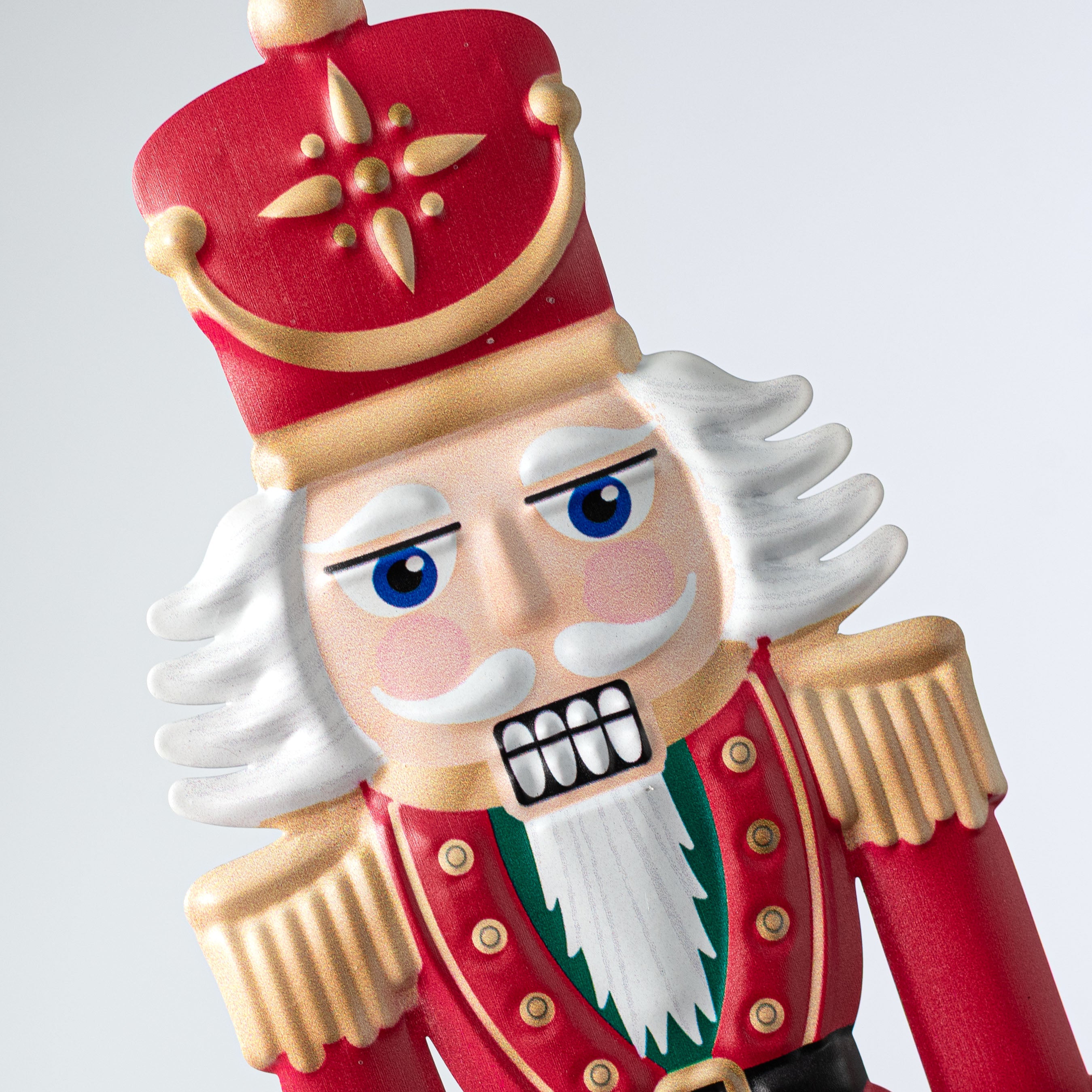 12" Metal Embossed Hanger: Light Traditional Nutcracker