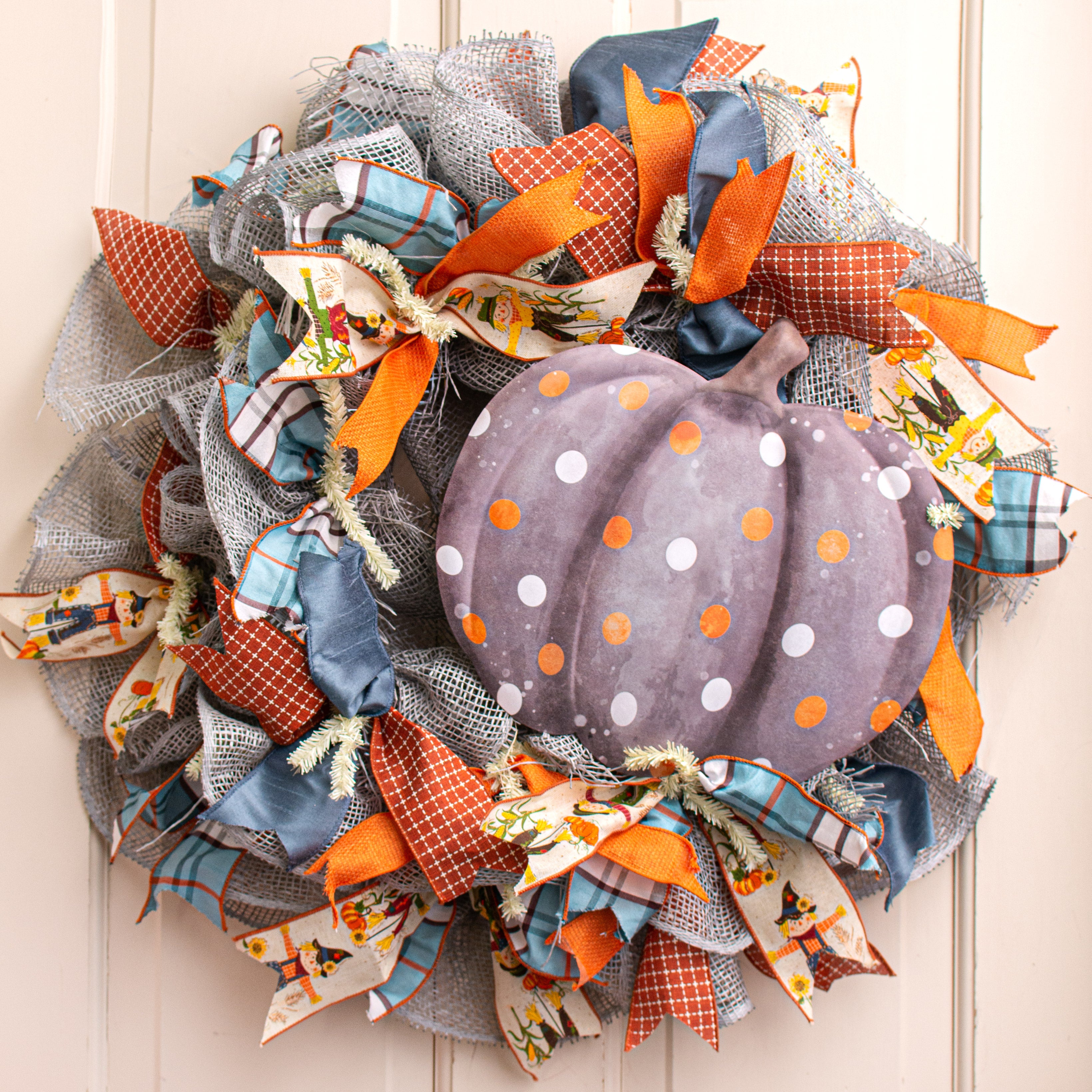 12" Metal Embossed Hanger: Black & Orange Polka Dot Pumpkin Lifestyle Photo