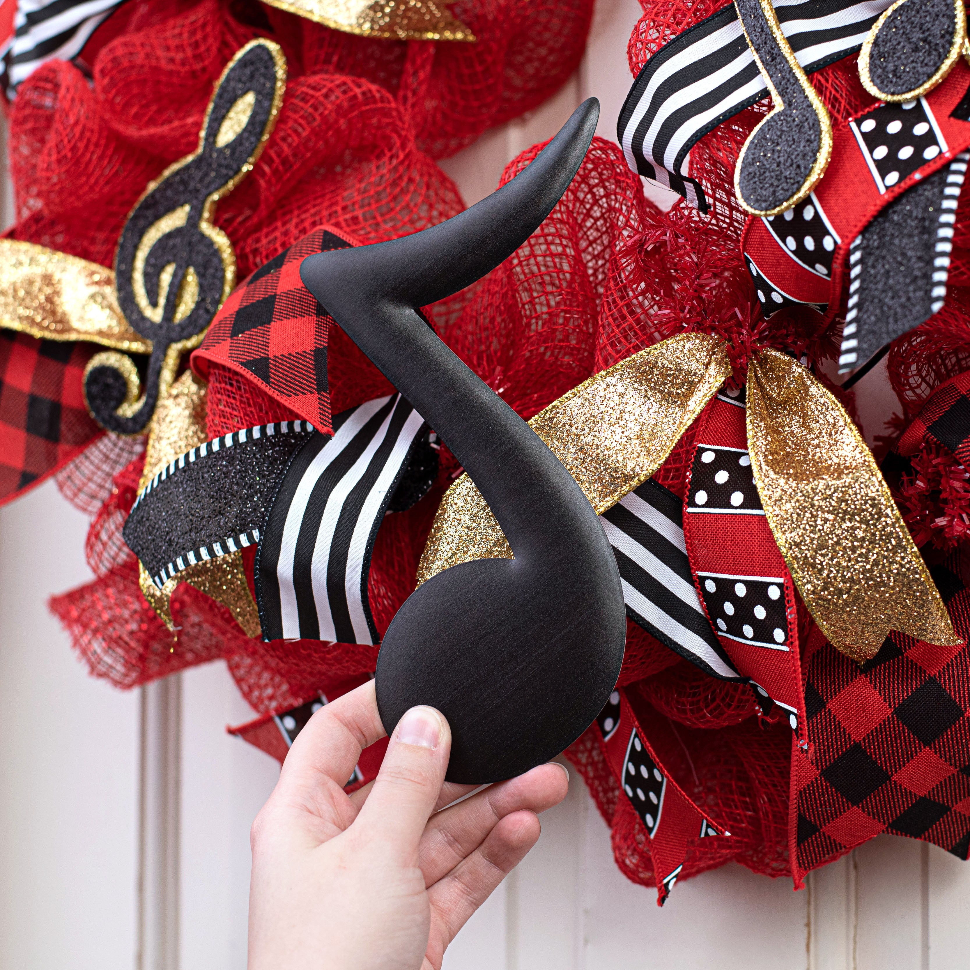 7" Metal Embossed Hanger: Black Single Music Note Lifestyle Photo