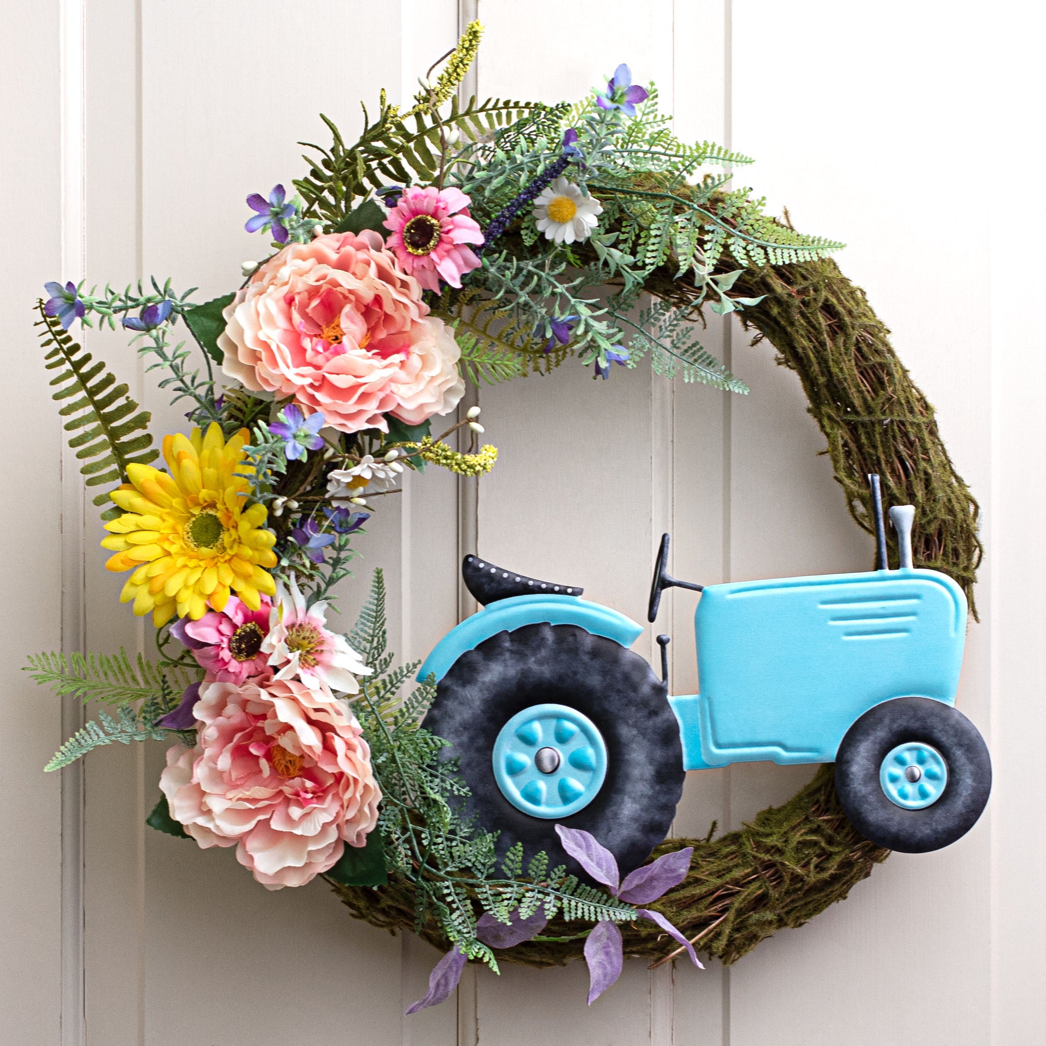 12" Metal Embossed Hanger: Blue Tractor Lifestyle Photo