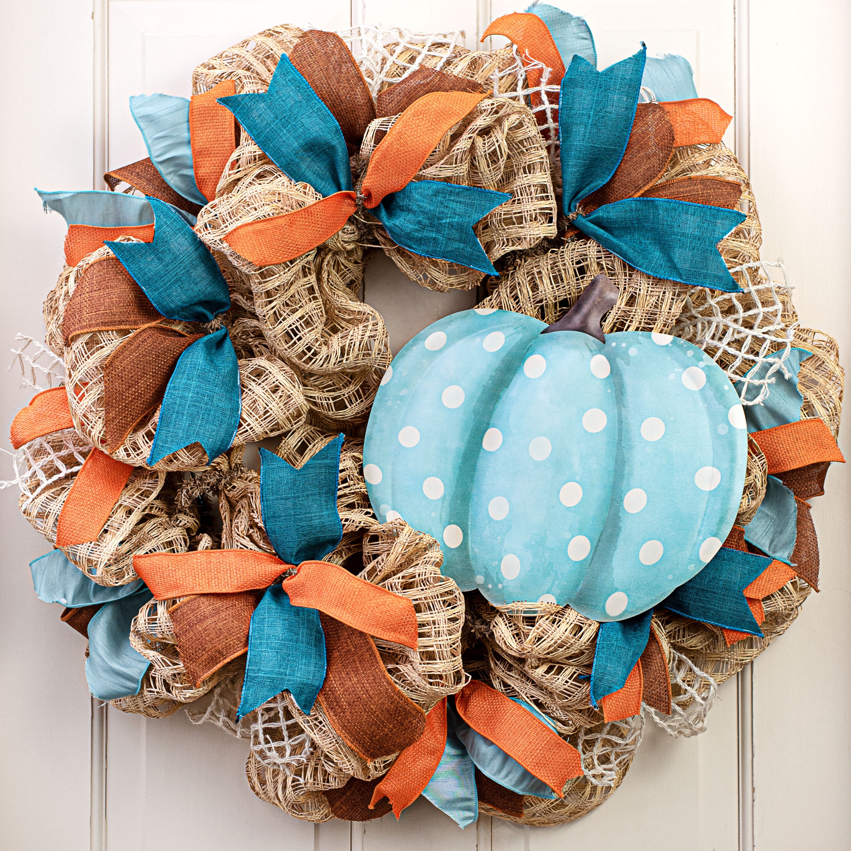 12" Metal Embossed Hanger: Teal & Cream Polka Dot Pumpkin Lifestyle Photo