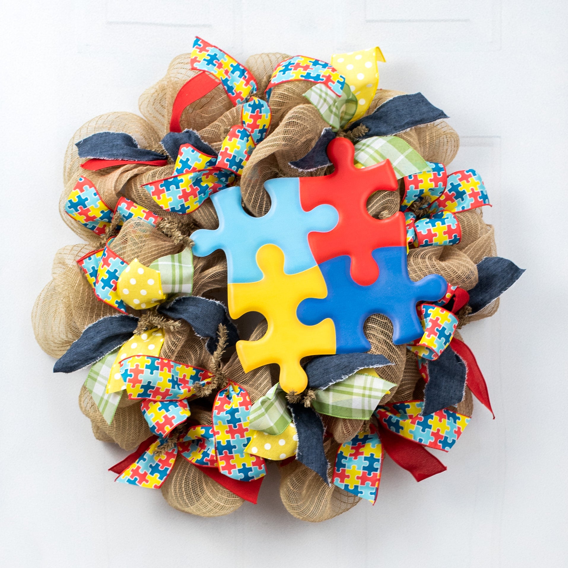 13" Metal Embossed Sign: Autism Awareness Puzzle Pieces Cutout Lifestyle Photo