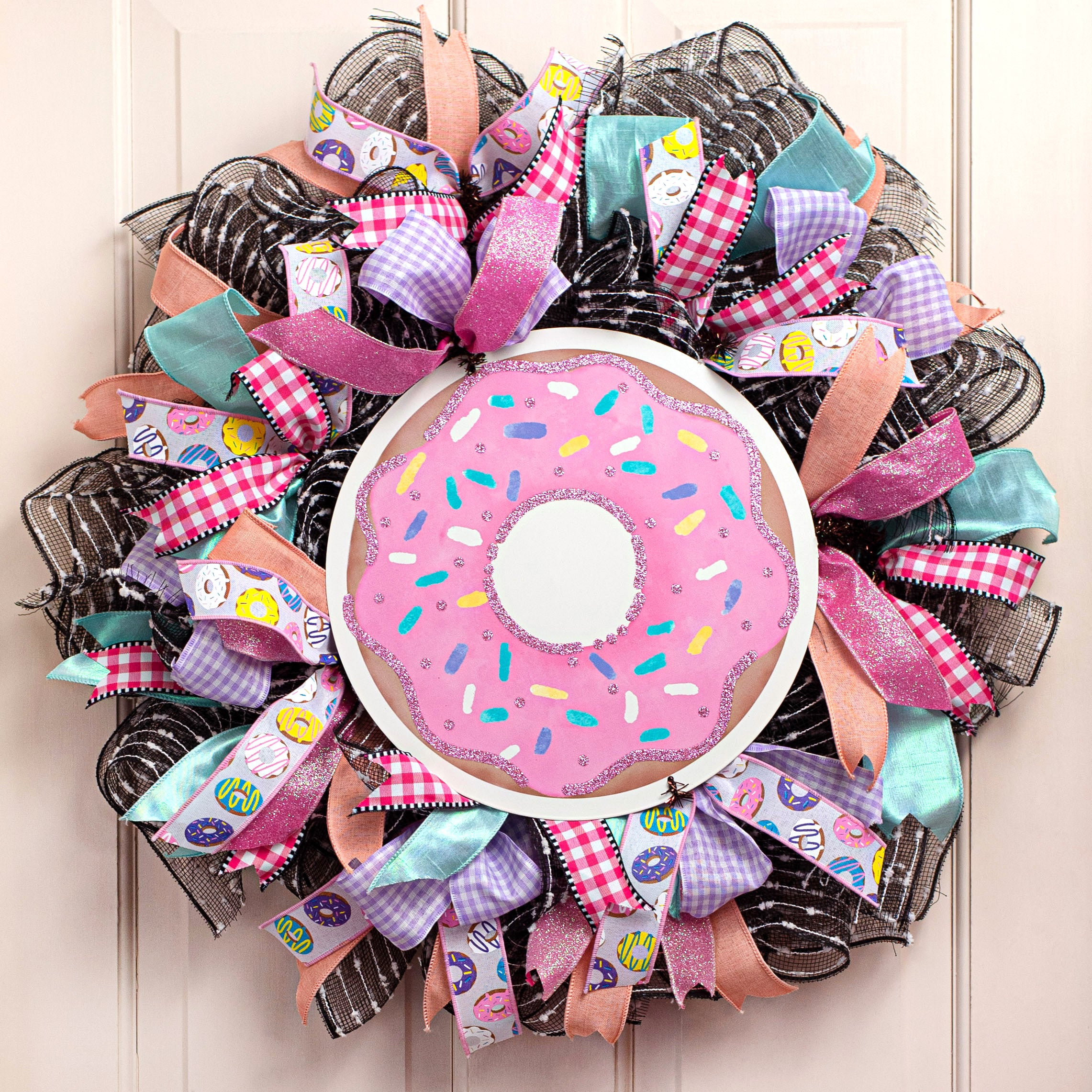 12" Metal Sign: Glitter Pink Donut Lifestyle Photo