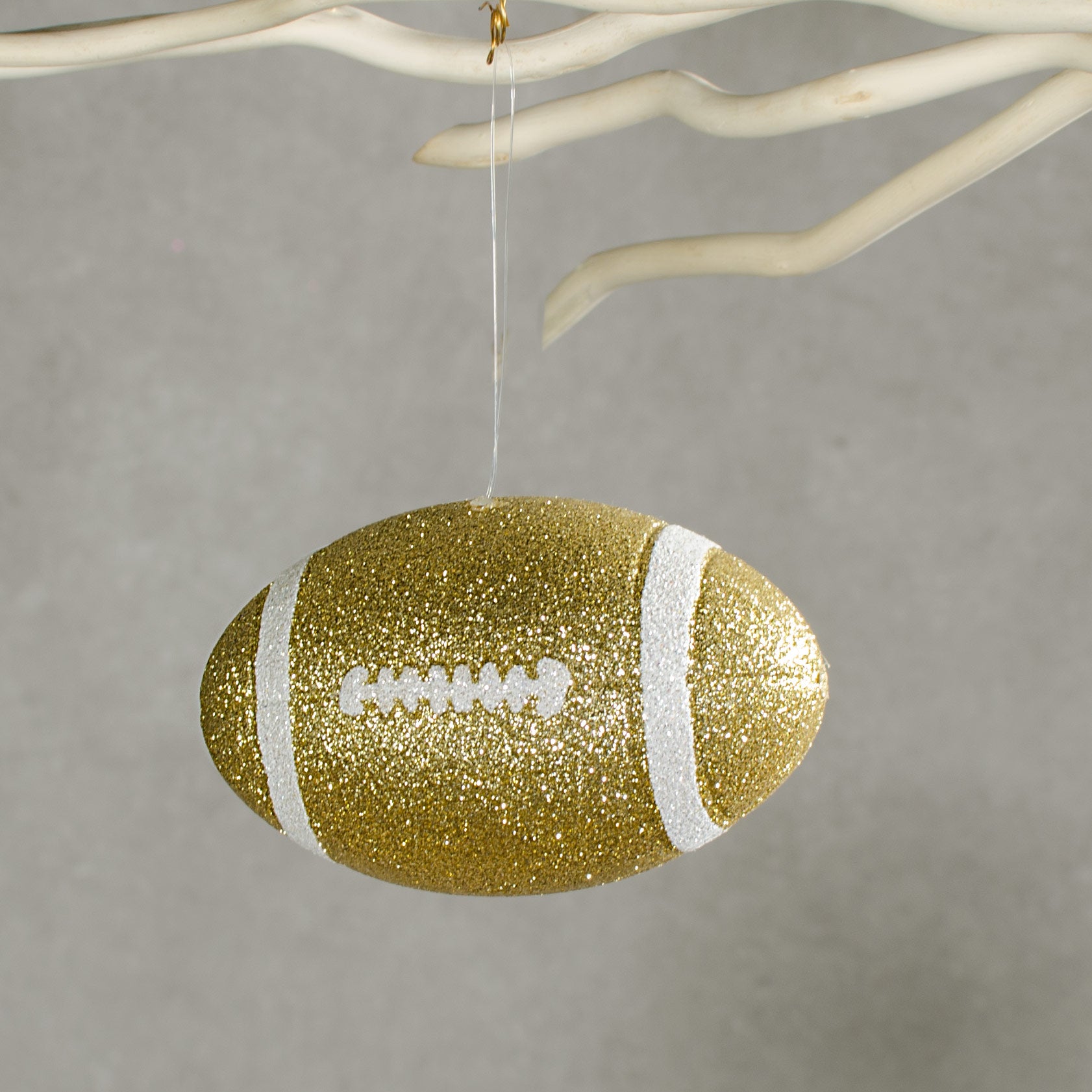 4.5" Metallic Glitter Football Ornament: Gold & White Lifestyle Photo