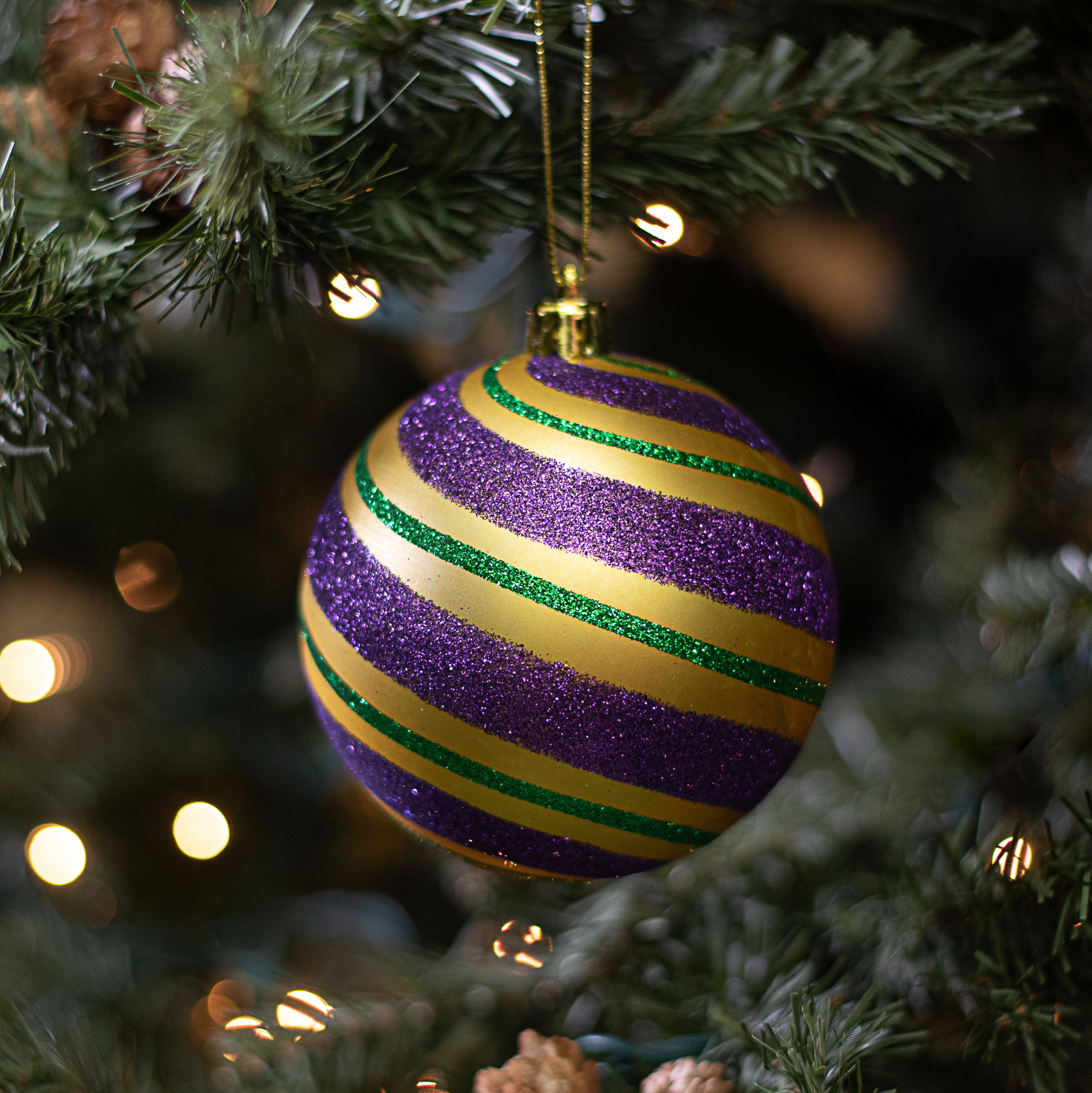 100MM Diagonal Glitter Stripe Ball Ornament: Mardi Gras Lifestyle Photo