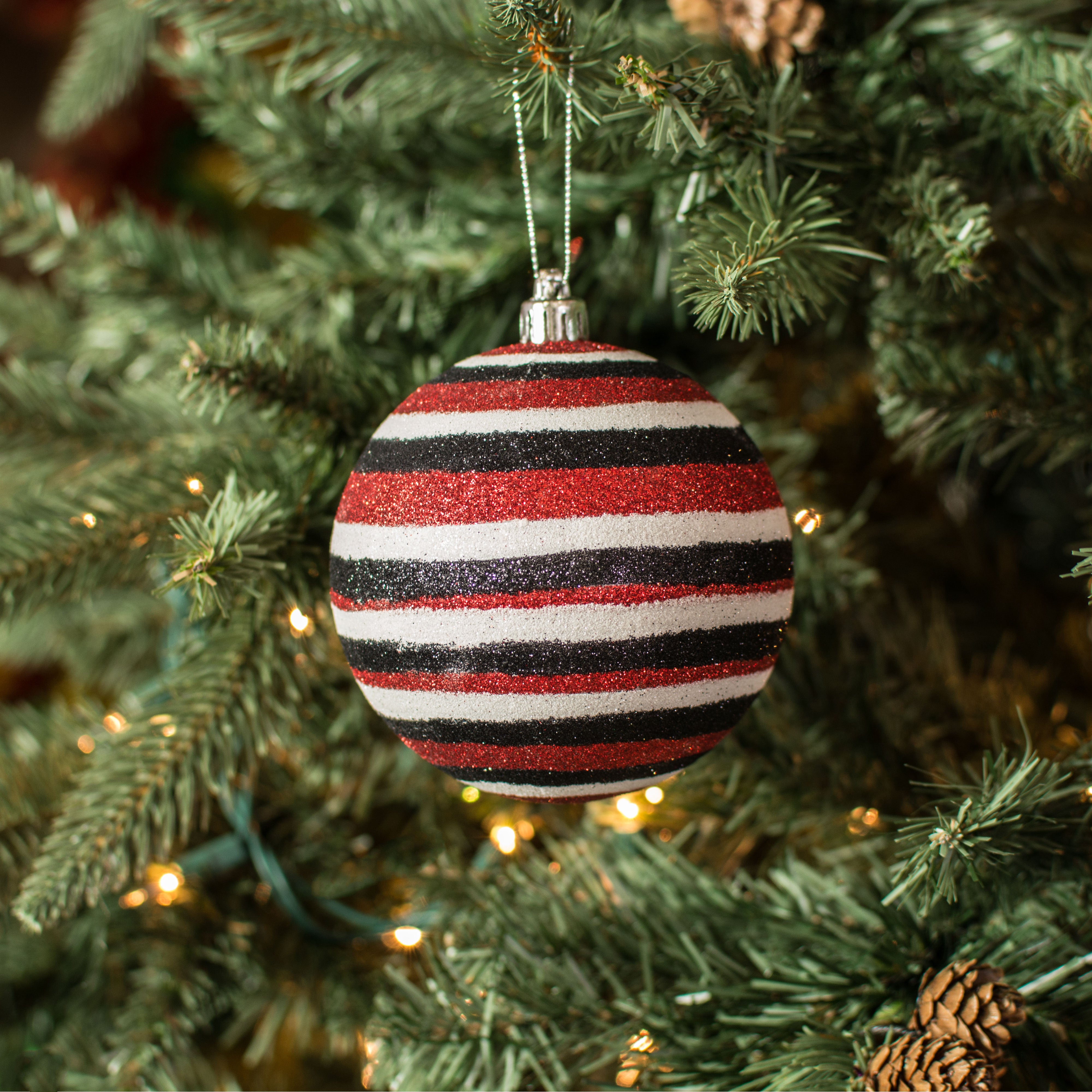 100MM Horizontal Stripe Glitter Ball Ornament: Red, Black, White Lifestyle Photo