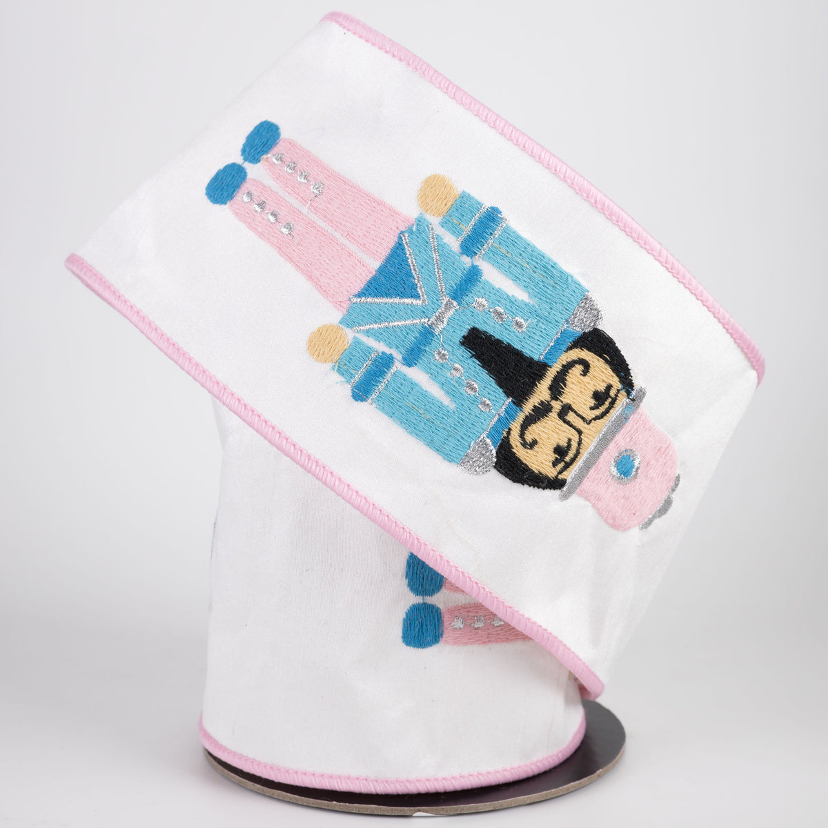 4" Nutcracker Embroidered Dupioni Ribbon with Fused Lining Back: White, Pink & Light Blue (5 Yards) Lifestyle Photo