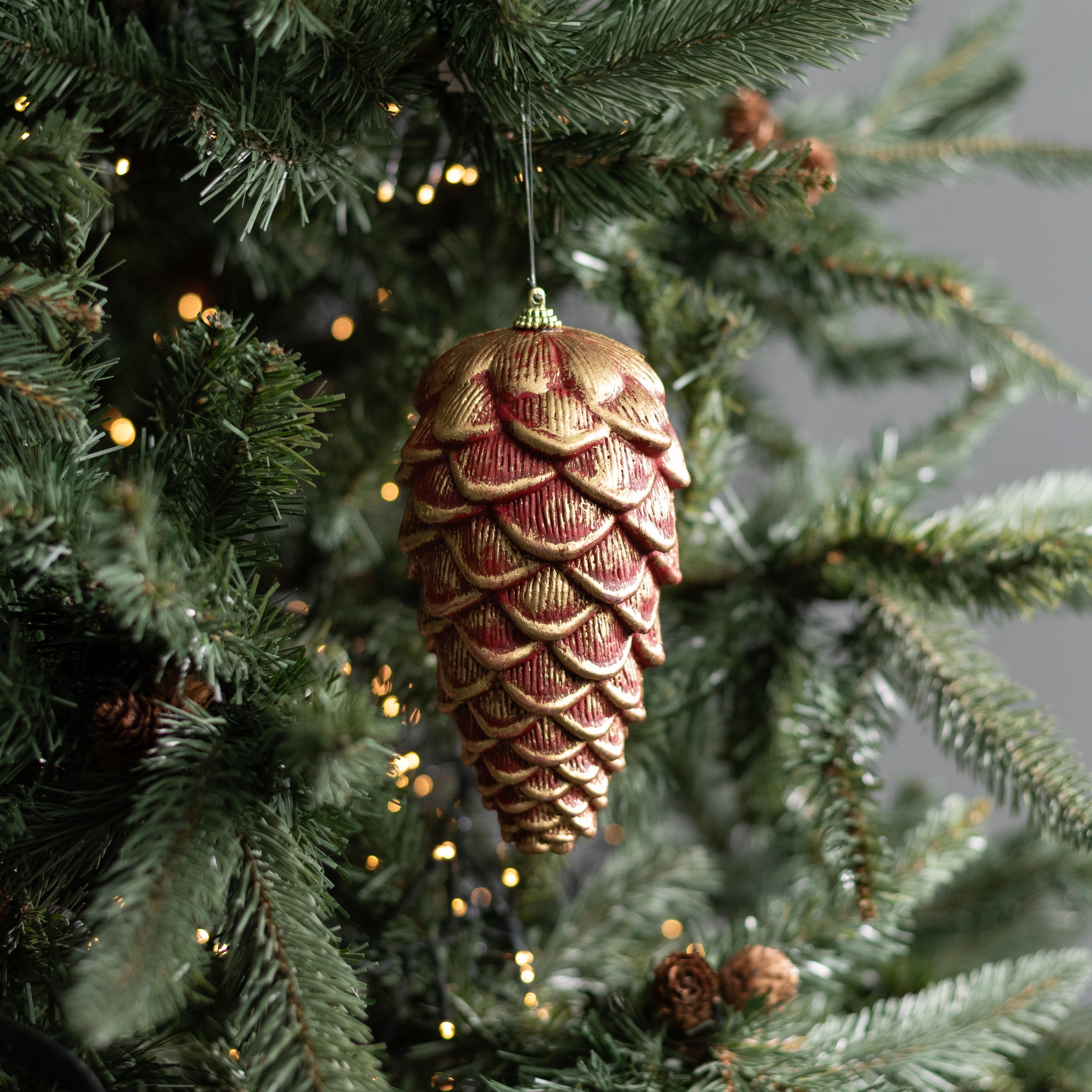 7" Pinecone Ornament: Dark Red & Gold Lifestyle Photo