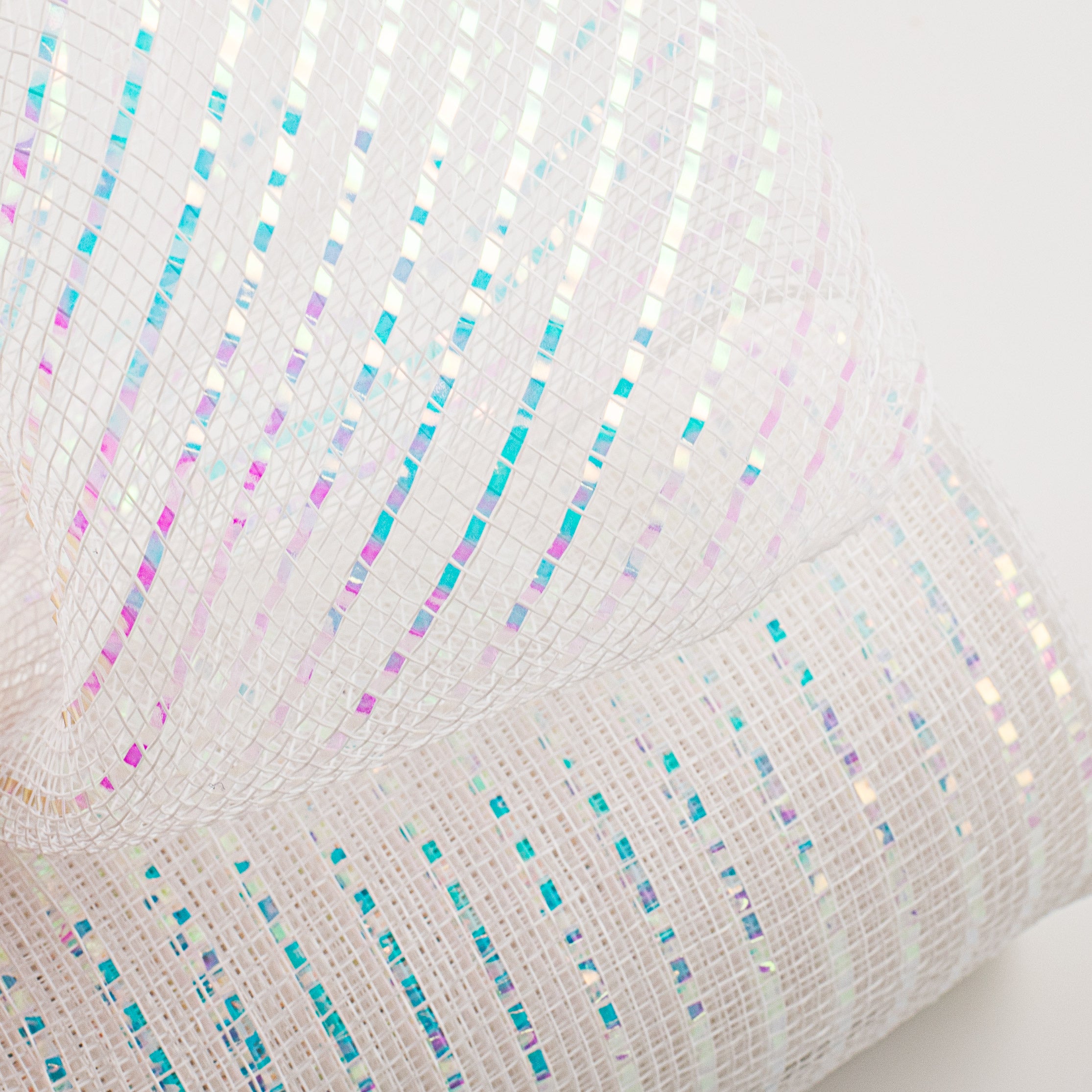 10" Poly Deco Mesh: Wide Foil Iridescent White Lifestyle Photo