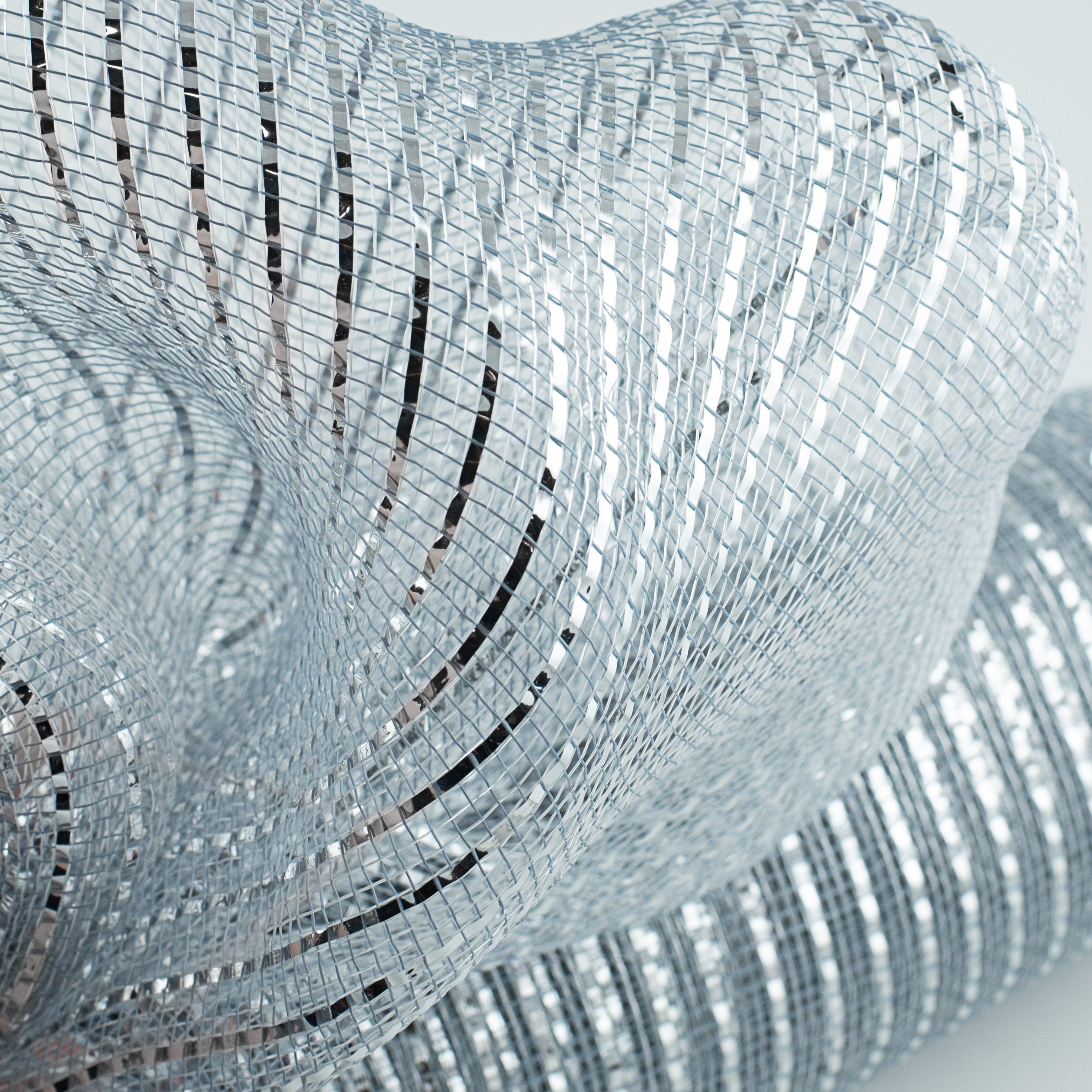21" Poly Deco Mesh: Wide Foil Metallic Silver Lifestyle Photo