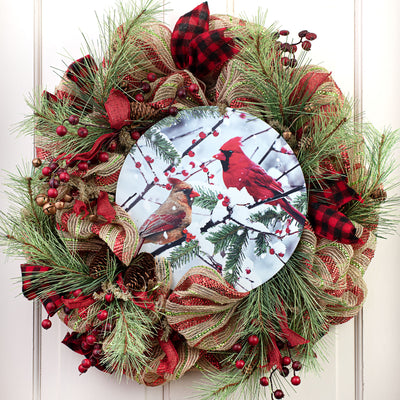 12" Round Metal Sign: Cardinals on Snowy Branch Lifestyle Photo