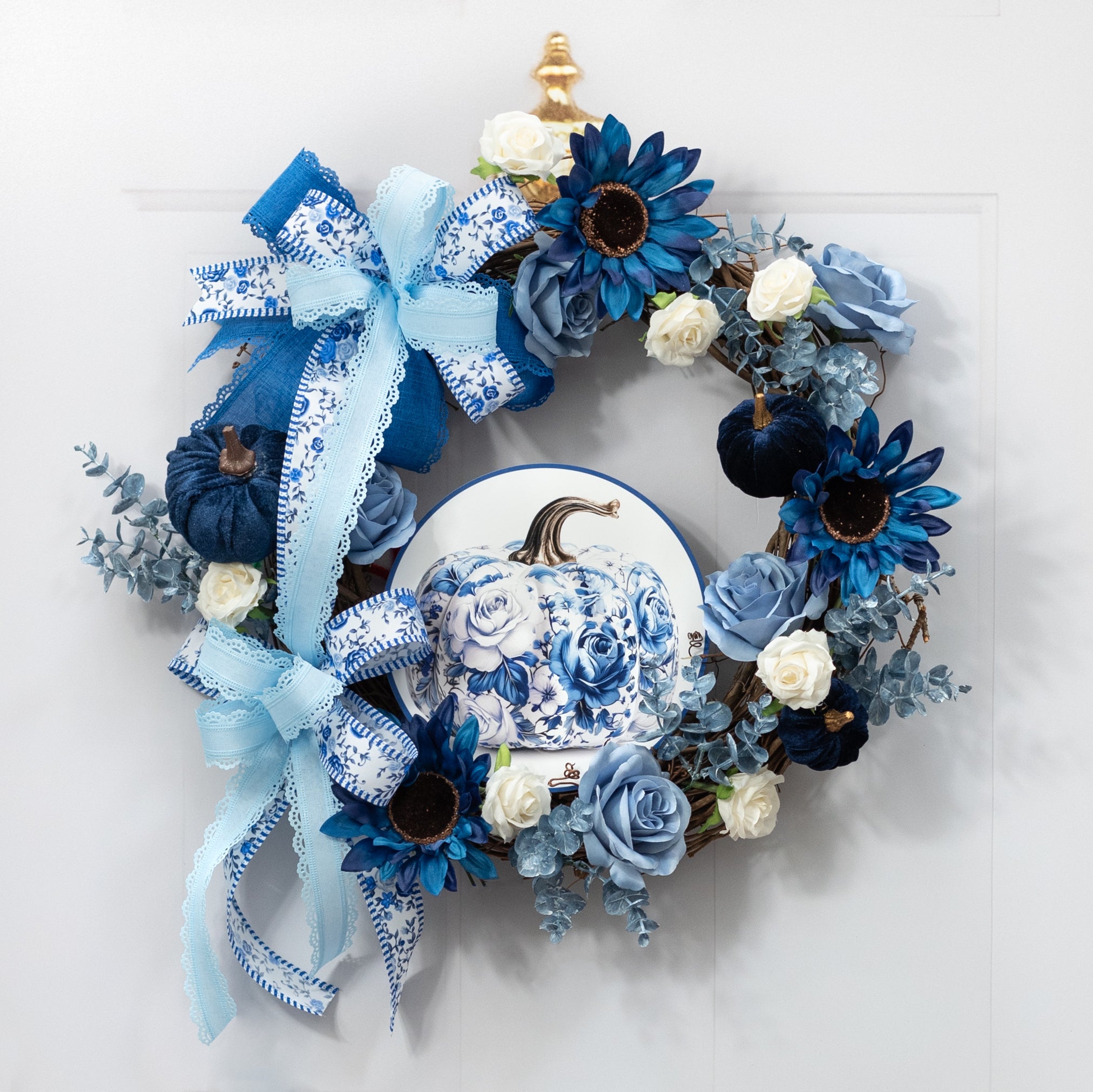 8.5" Round Waterproof Sign: Blue & White Roses Floral Pumpkin Lifestyle Photo