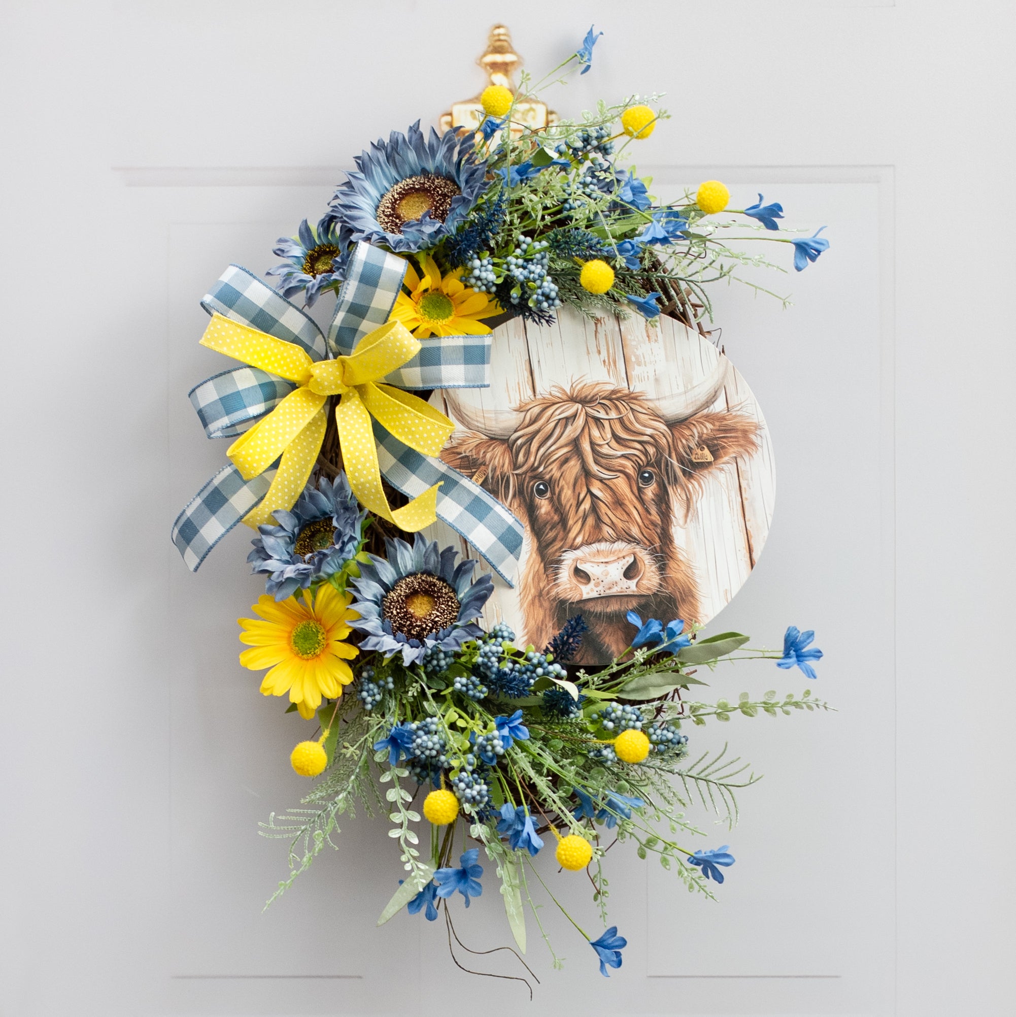 10.5" Round Waterproof Accent Sign: Highland Cow on Wood Lifestyle Photo