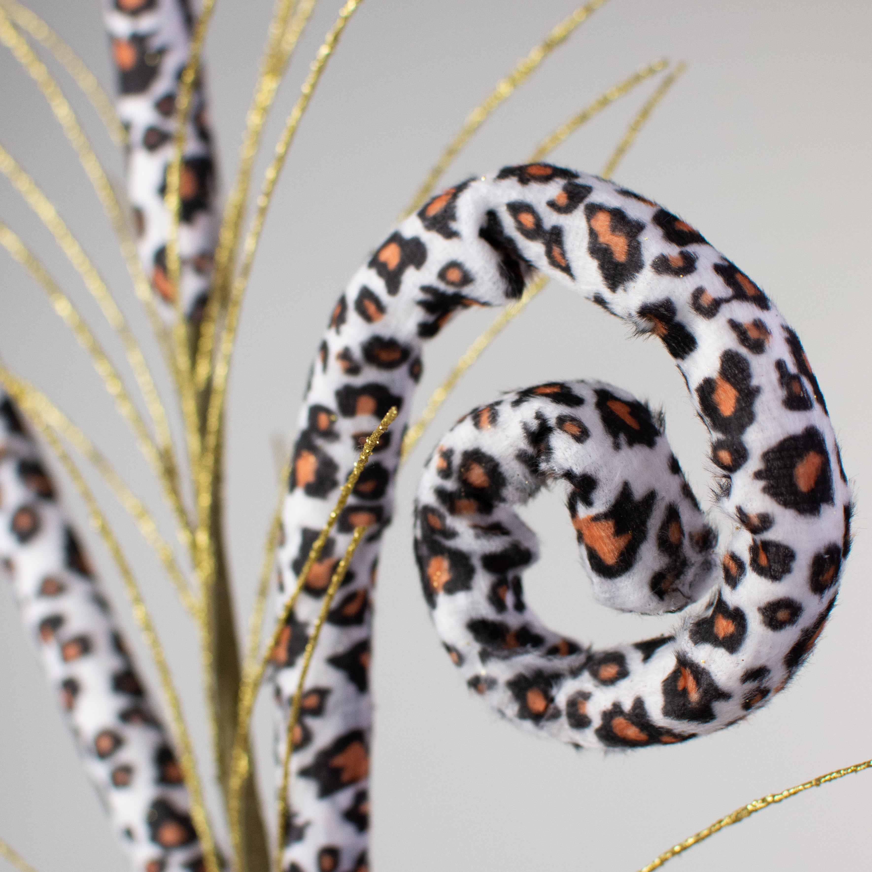 31" Snow Leopard Print Tubing Coil With Spray Lifestyle Photo