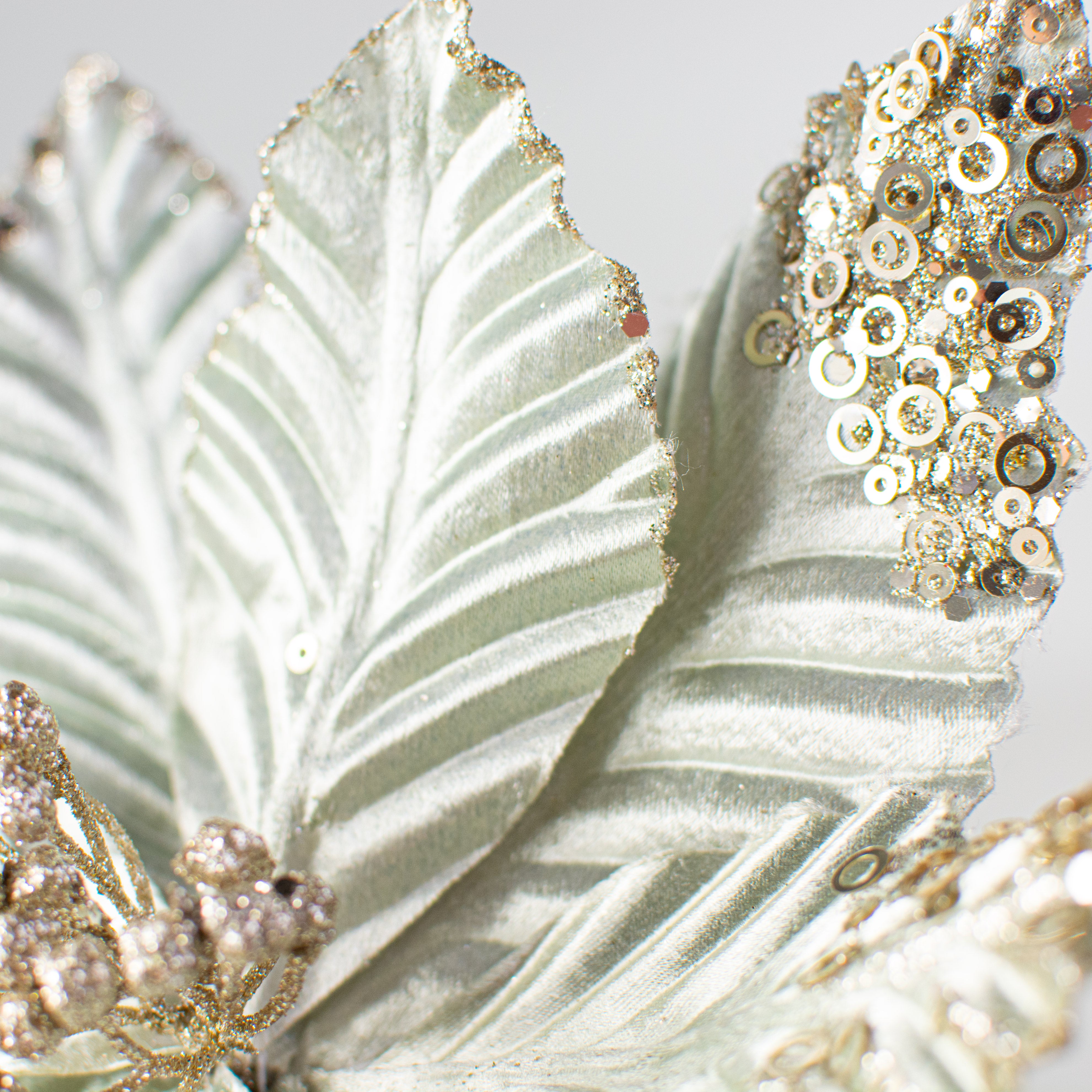 11" Velvet Glitter Poinsettia Stem: Sage Green Lifestyle Photo