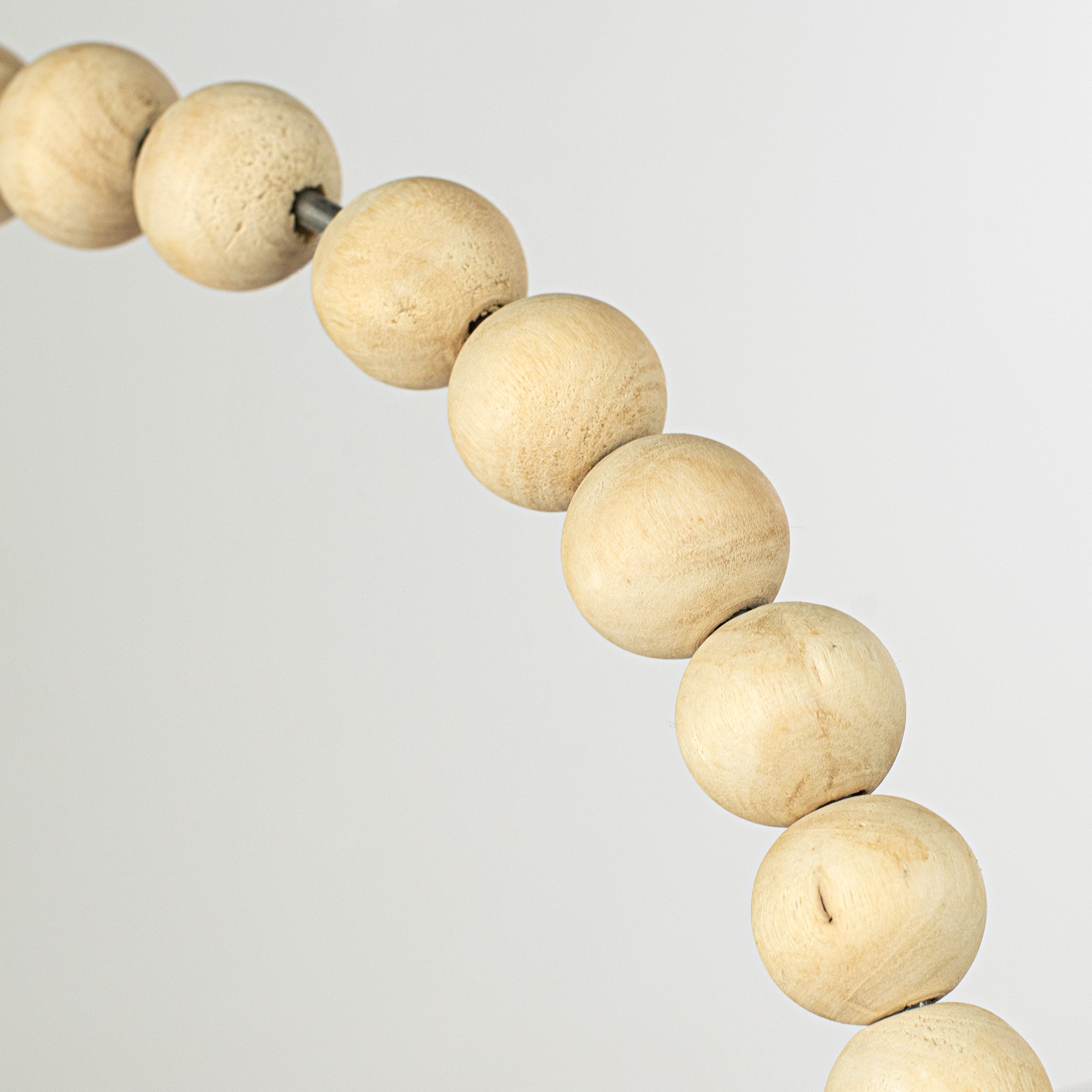 15.5" Wood Bead Wreath: Bleached detail photo 3