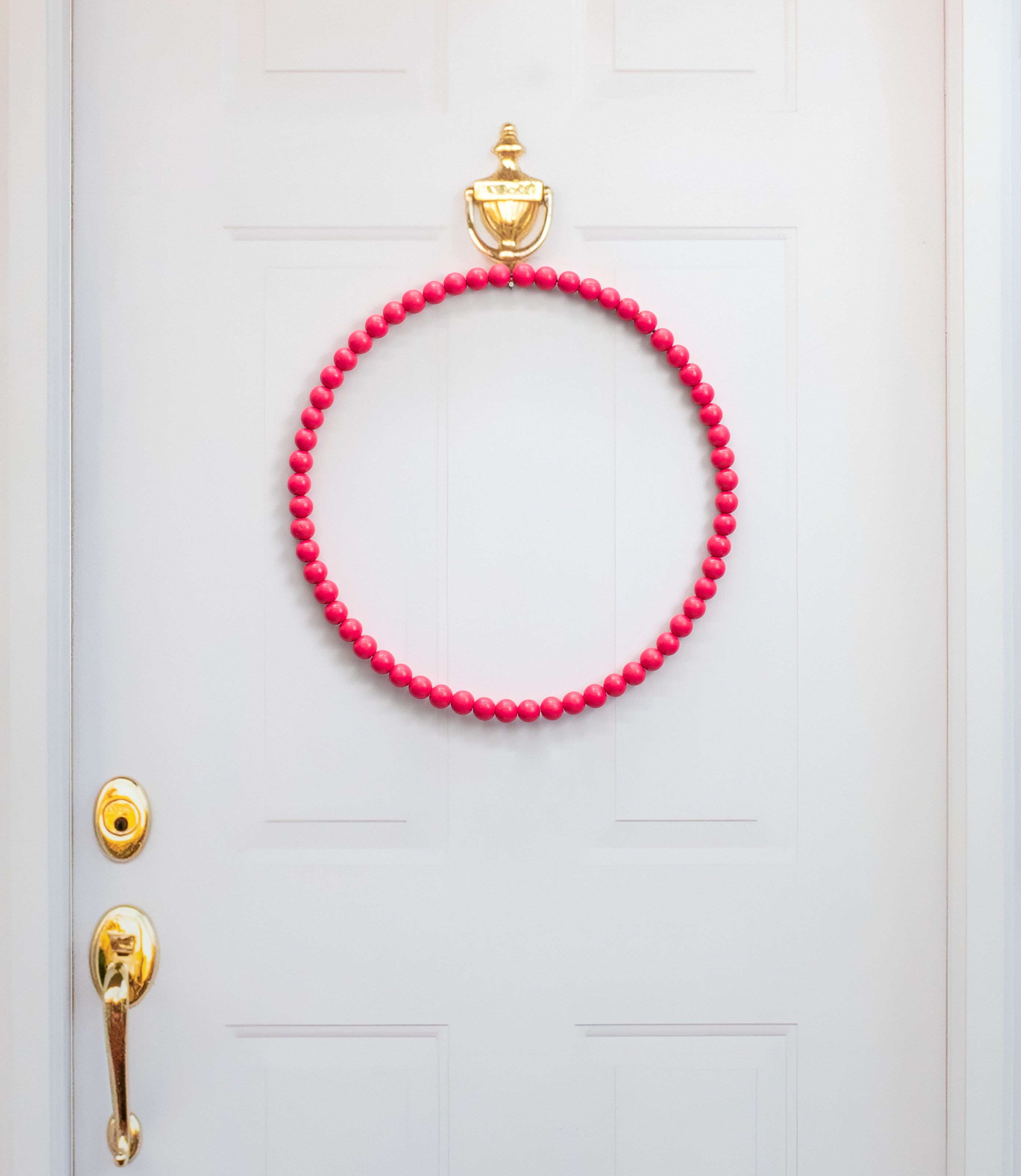 17.75" Wood Bead Wreath: Hot Pink Lifestyle Photo