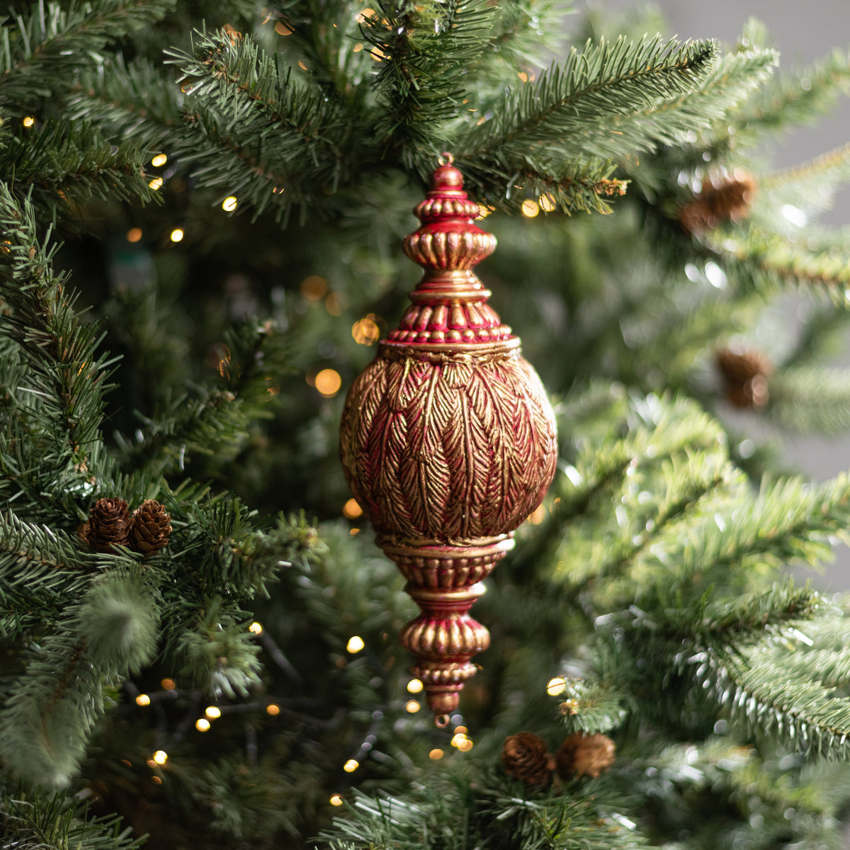 11" Antiqued Feather Finial Ornament: Dark Red & Gold Lifestyle Photo