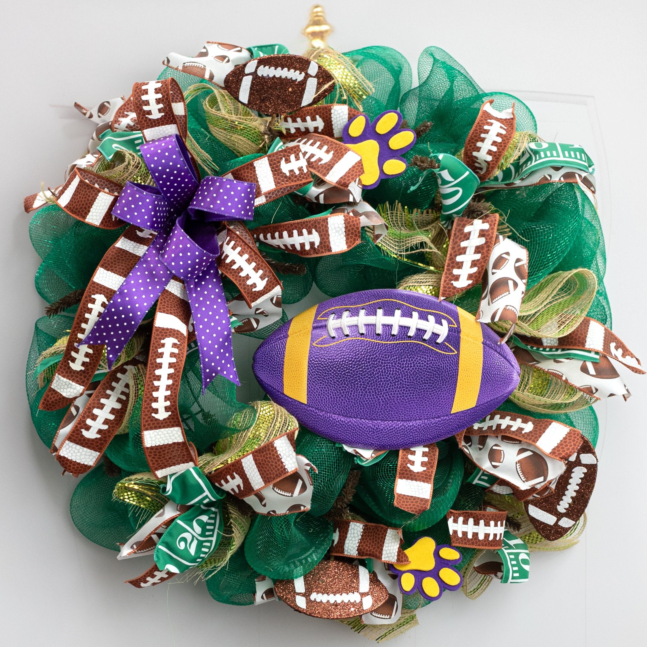 11" Embossed Metal Football Sign: Purple & Golden Yellow Lifestyle Photo