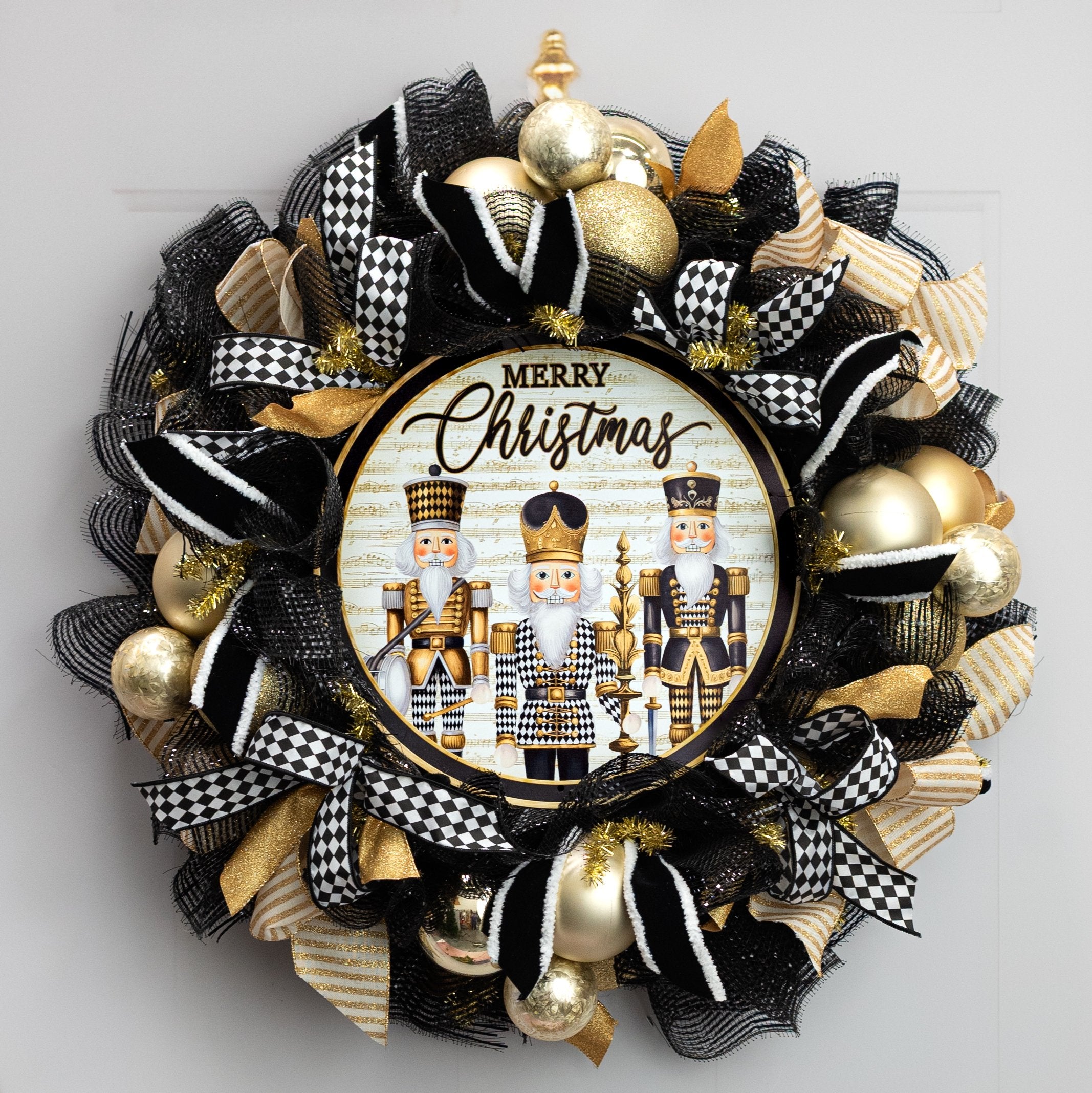 12" Round Metal Sign: Merry Christmas Harlequin Nutcrackers Lifestyle Photo