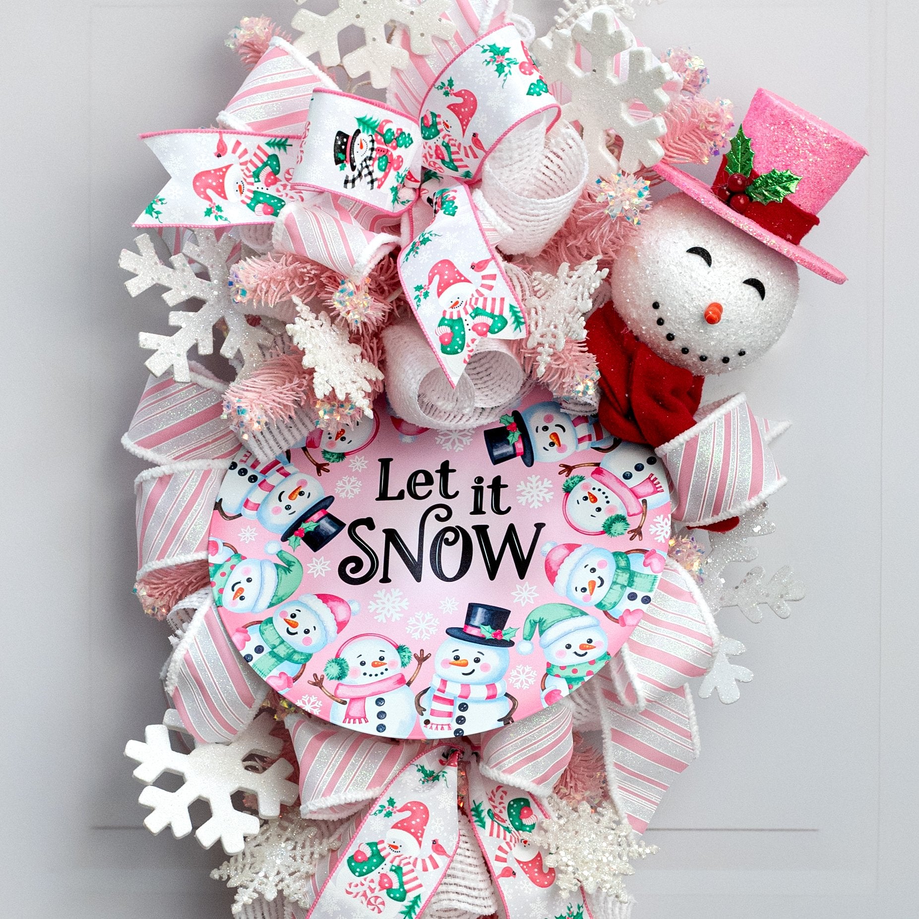 12" Round Metal Sign: Pink Let it Snow Snowmen Lifestyle Photo
