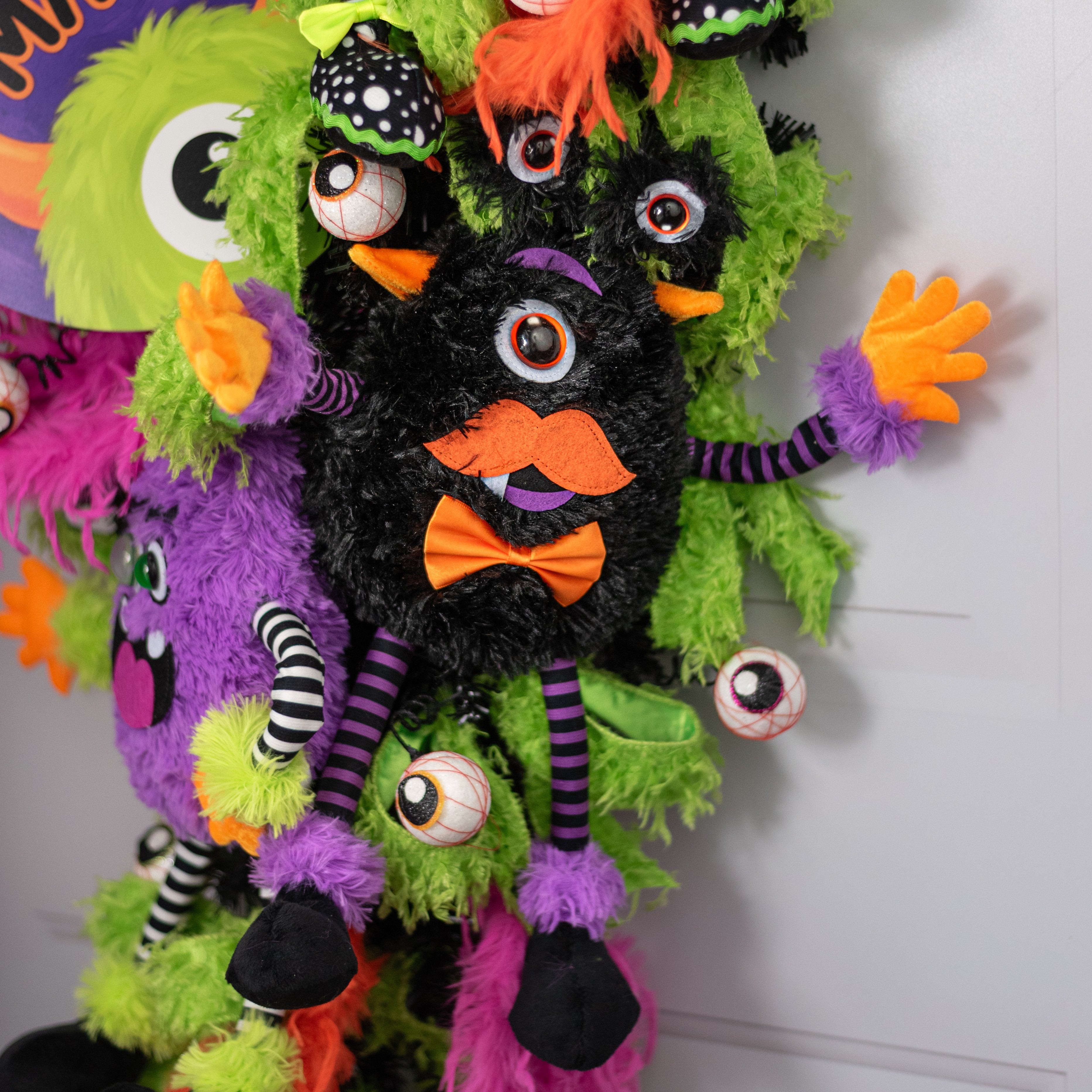 15" Plush Bow-Tie Halloween Monster Wreath Decor: Black Lifestyle Photo