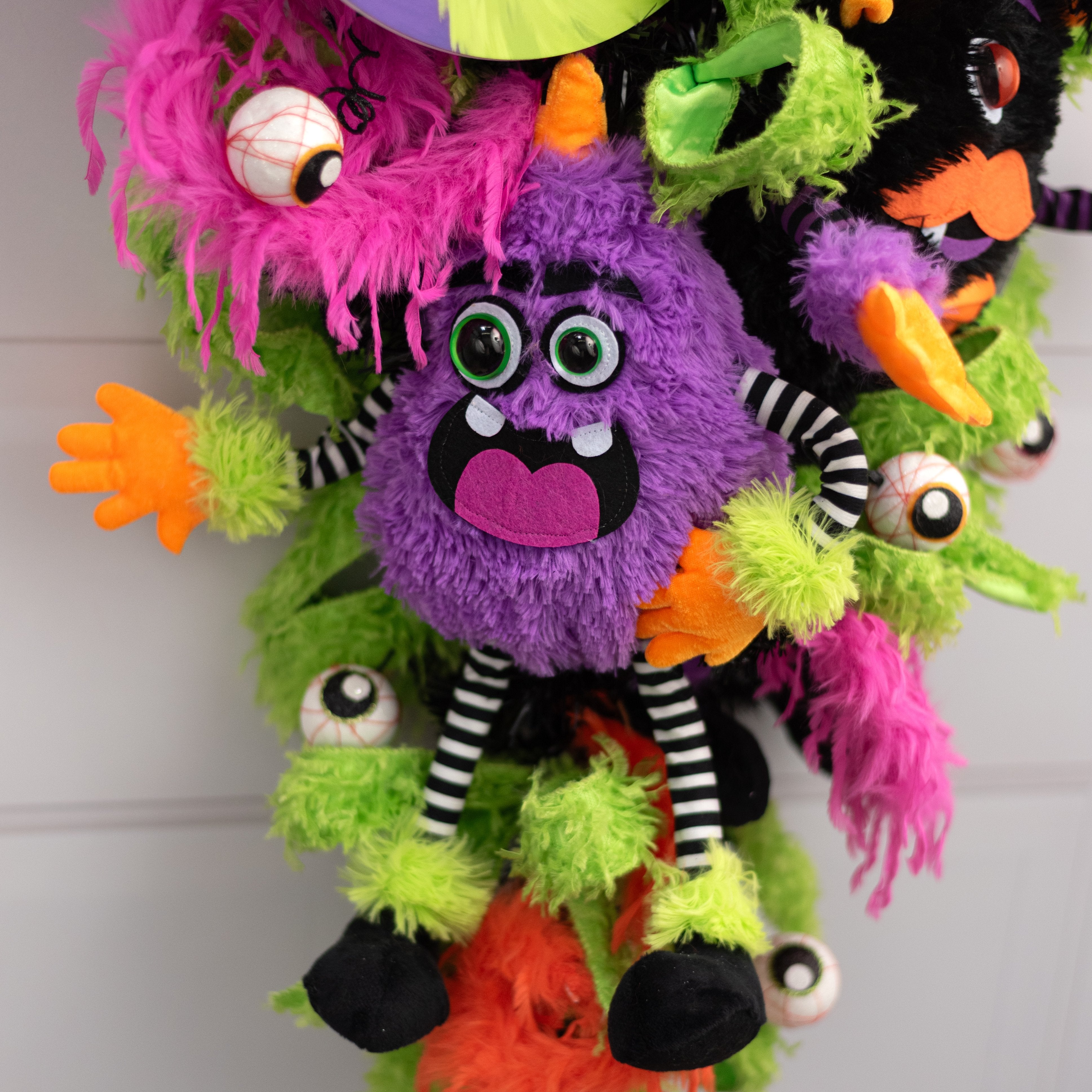 15" Plush Horned Halloween Monster Wreath Decor: Purple Lifestyle Photo